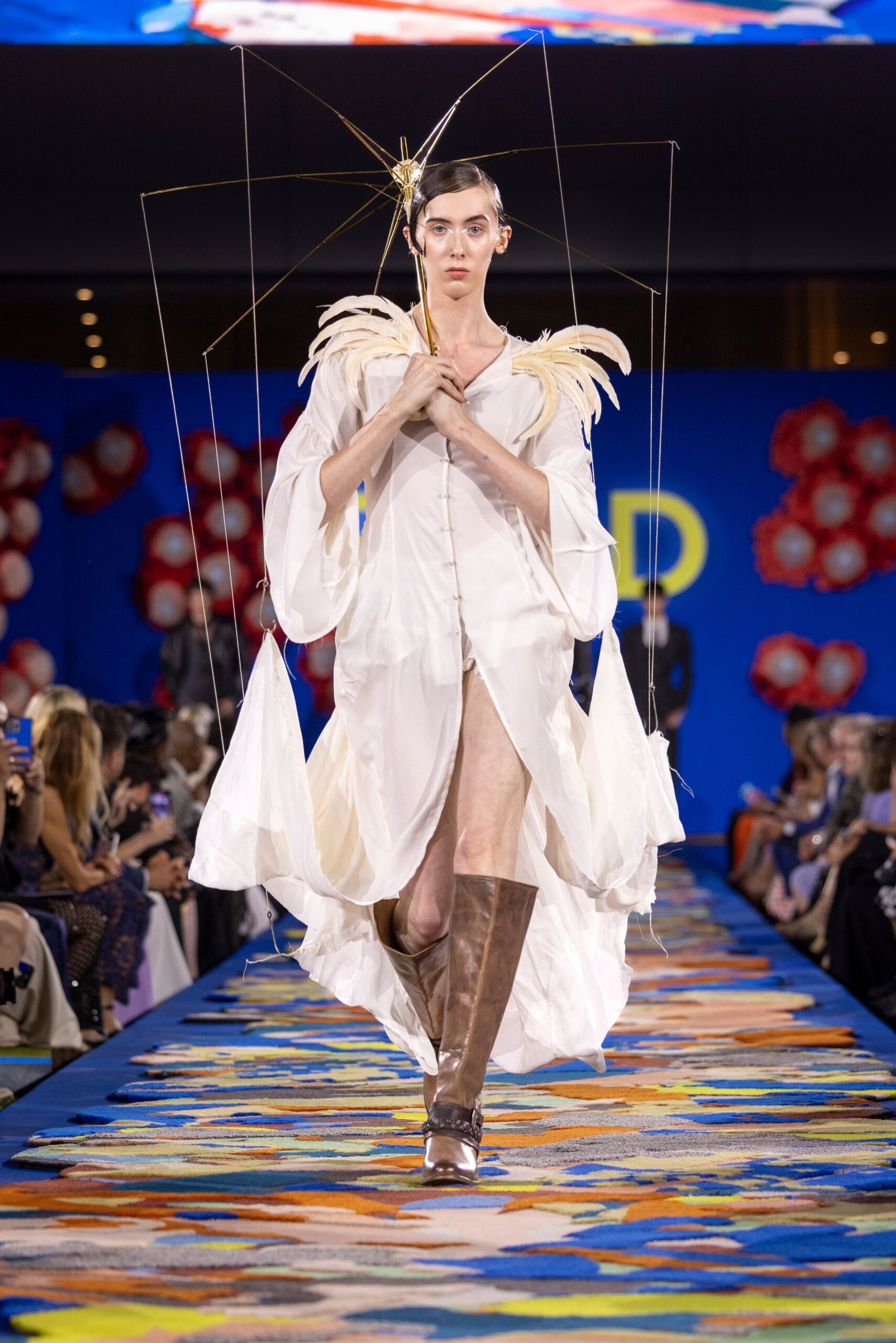 white silk draped gown with brown boots