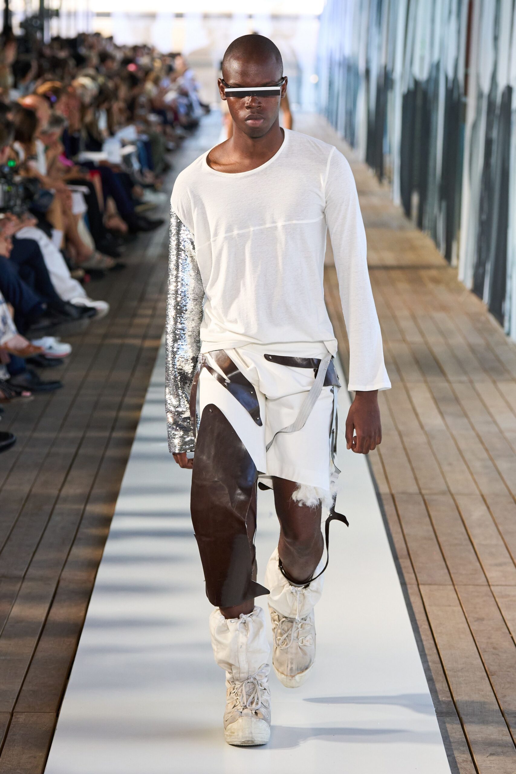 white relaxed top with distressed pants