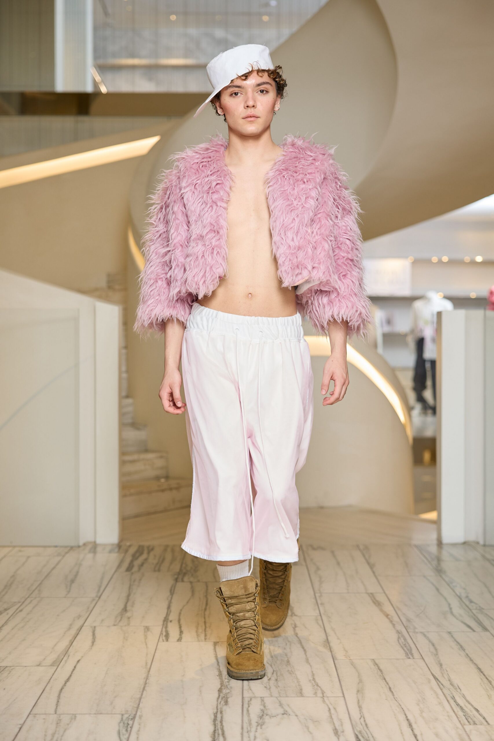 pink faux-fur jacket with white pants