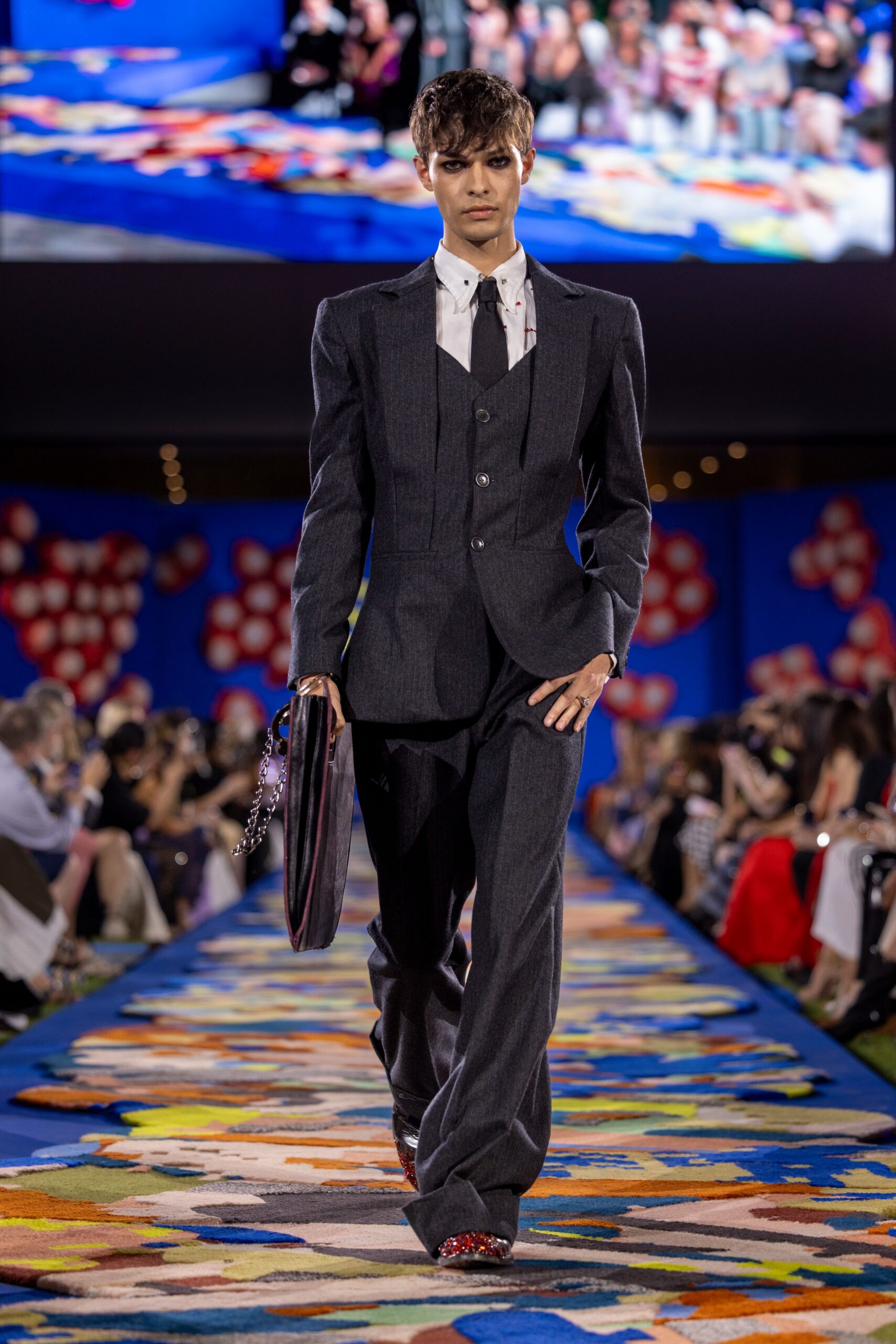 gray tailored suit with red shoes