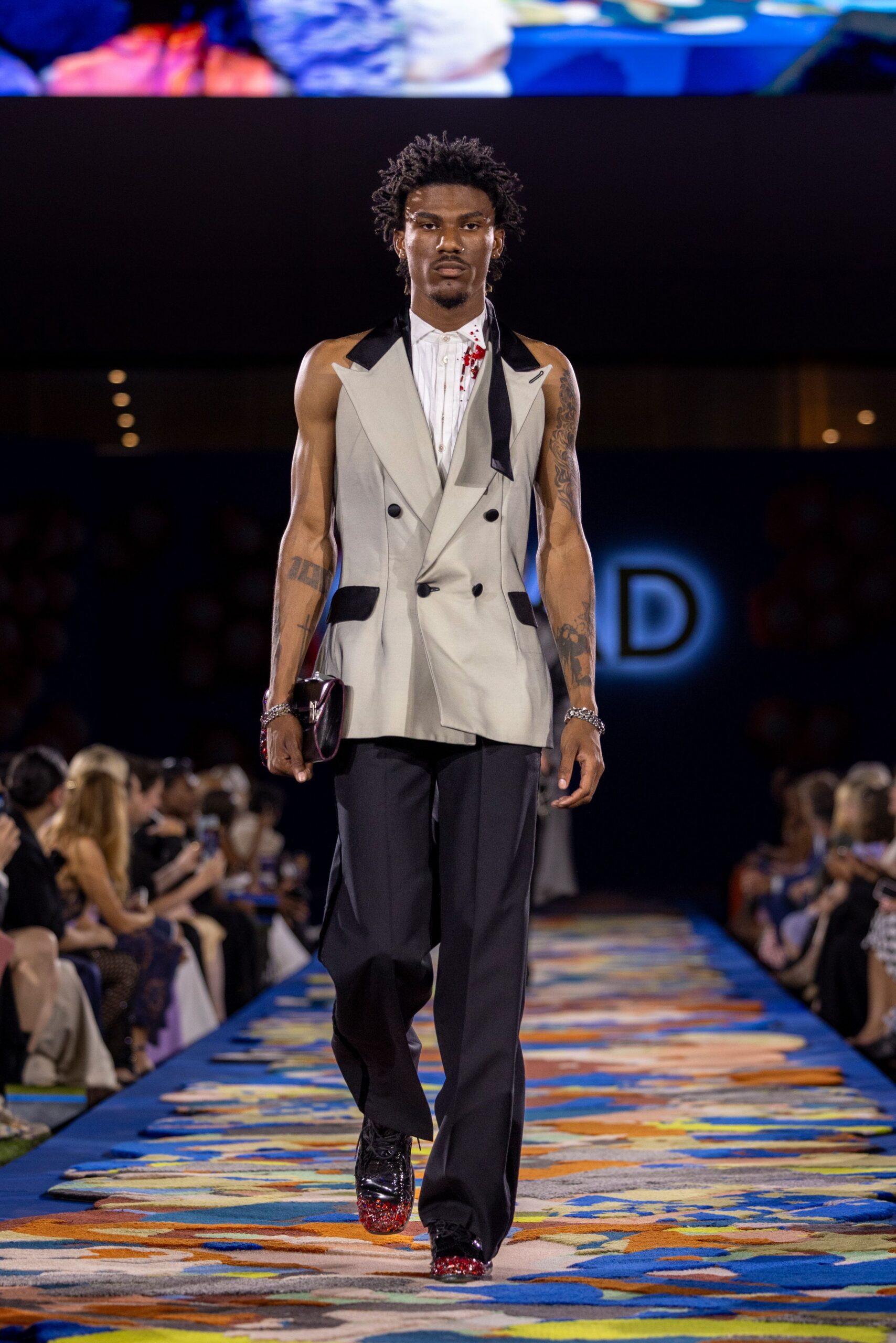 gray tailored suit with black pants