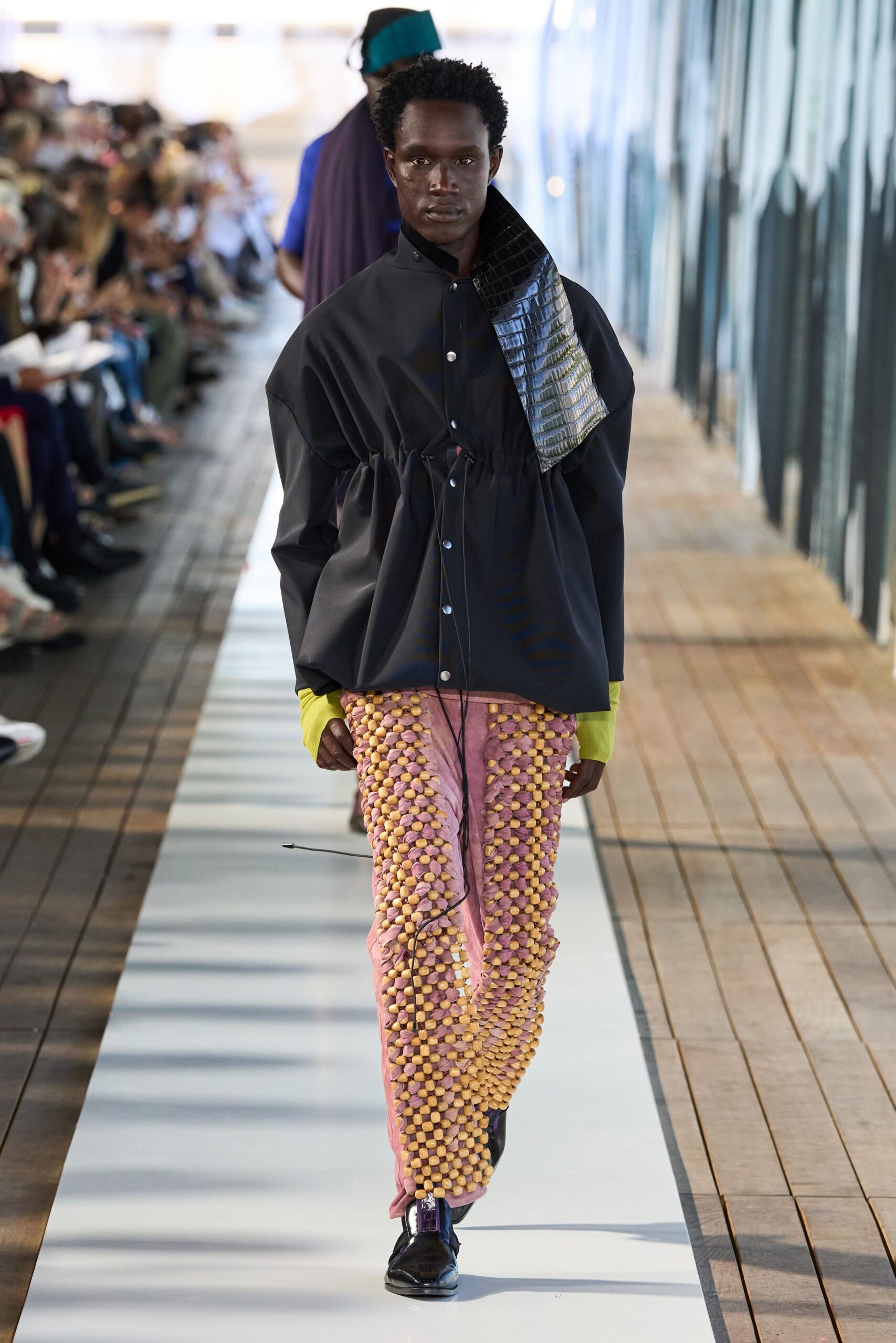 black relaxed jacket with checked pants
