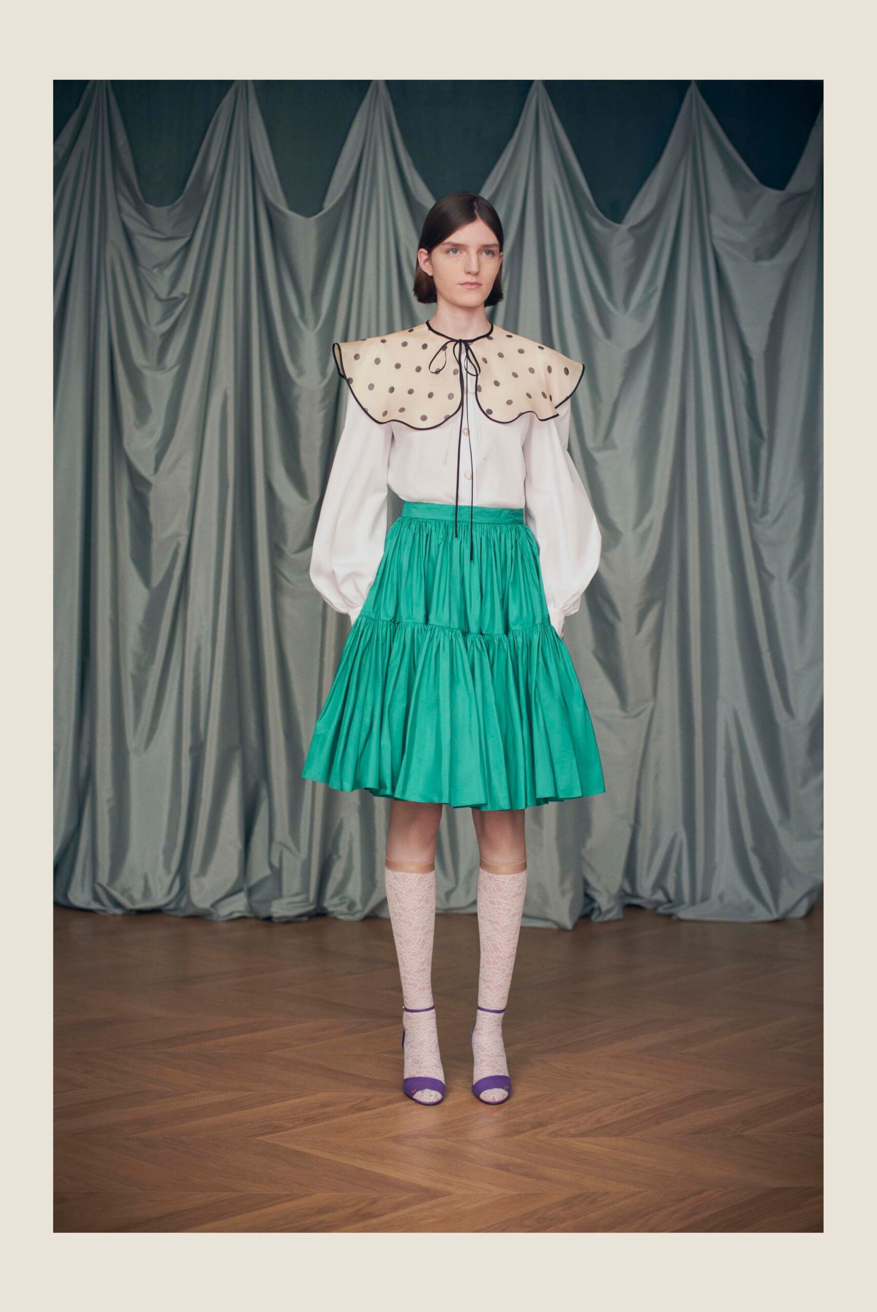 white blouse green tiered skirt