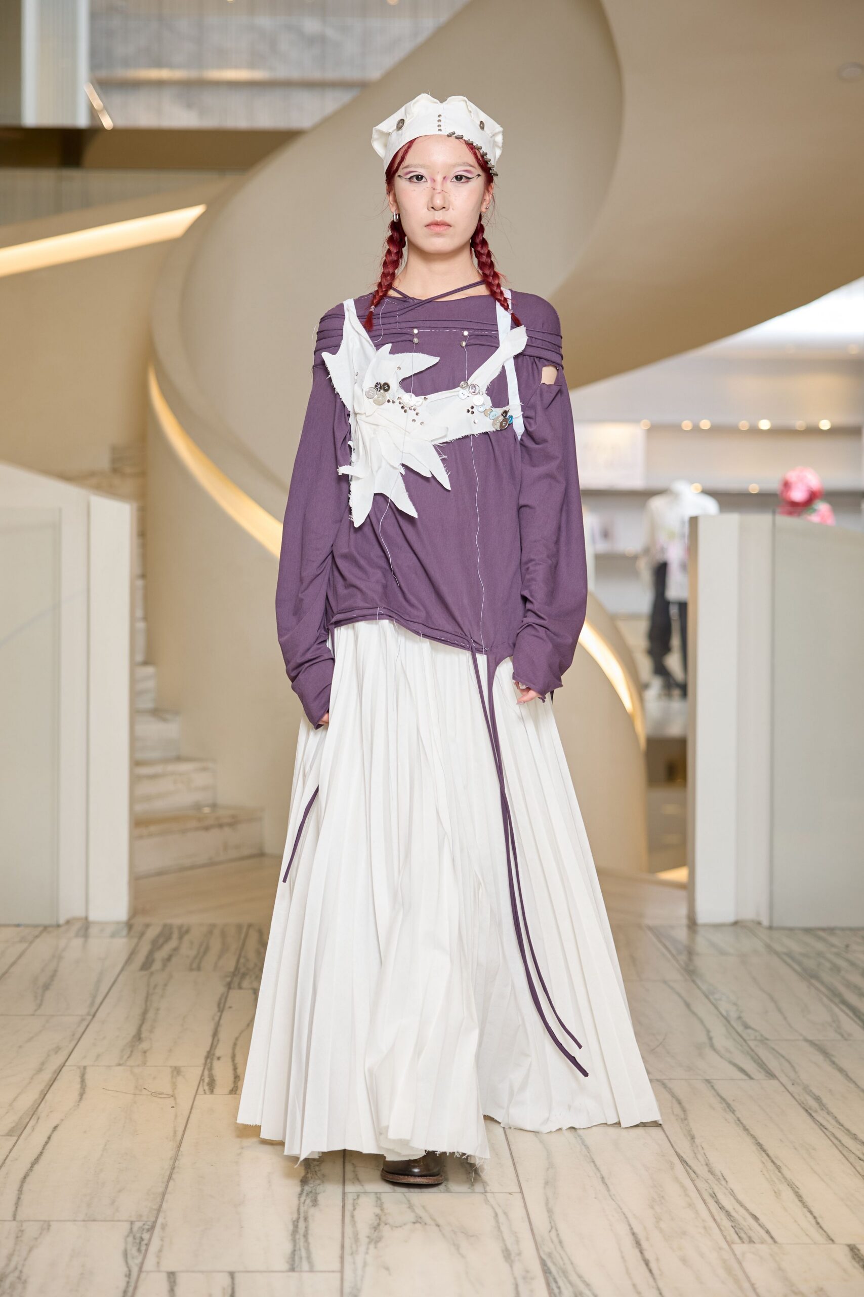 purple relaxed top with white pleated skirt