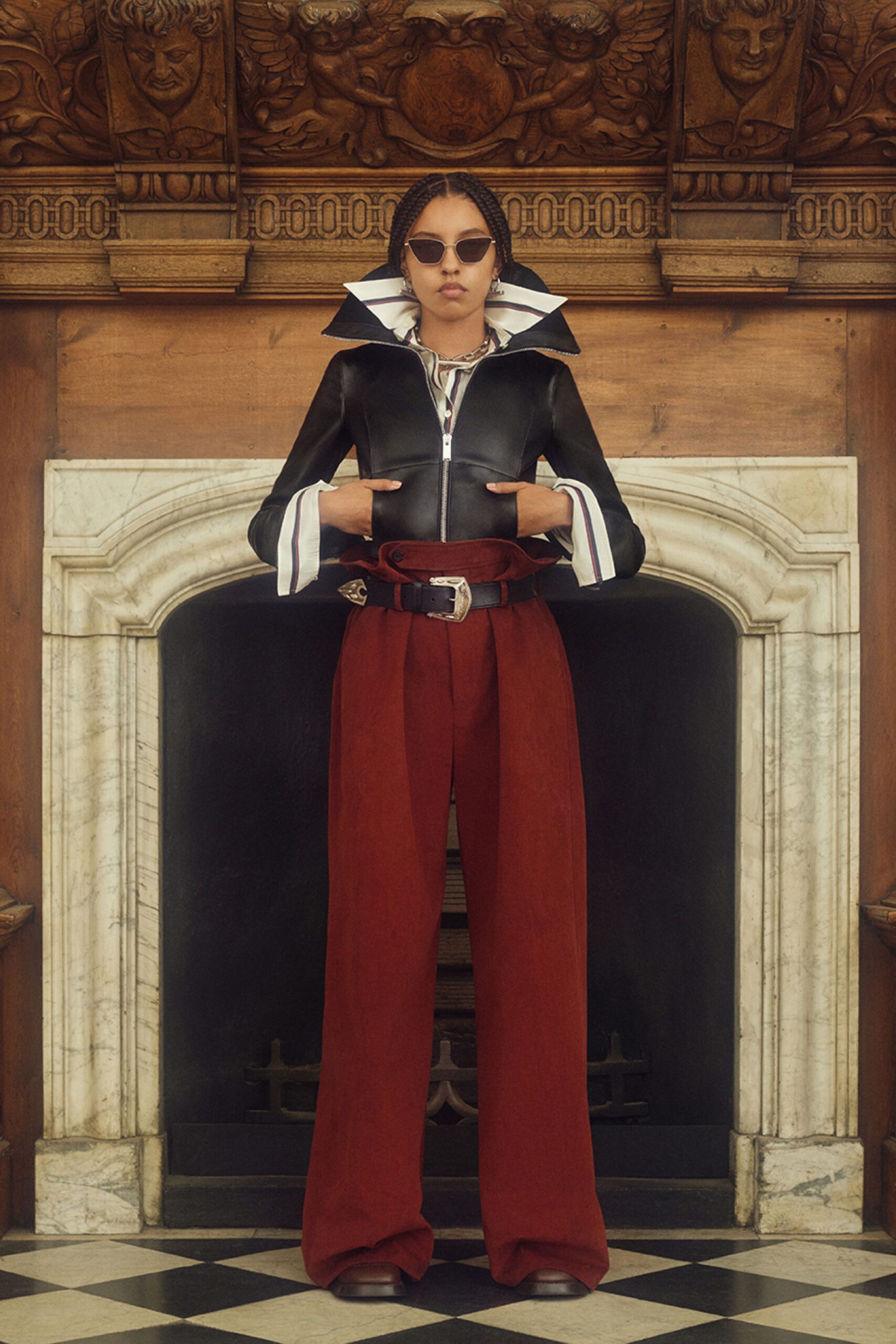 black leather jacket and red pants