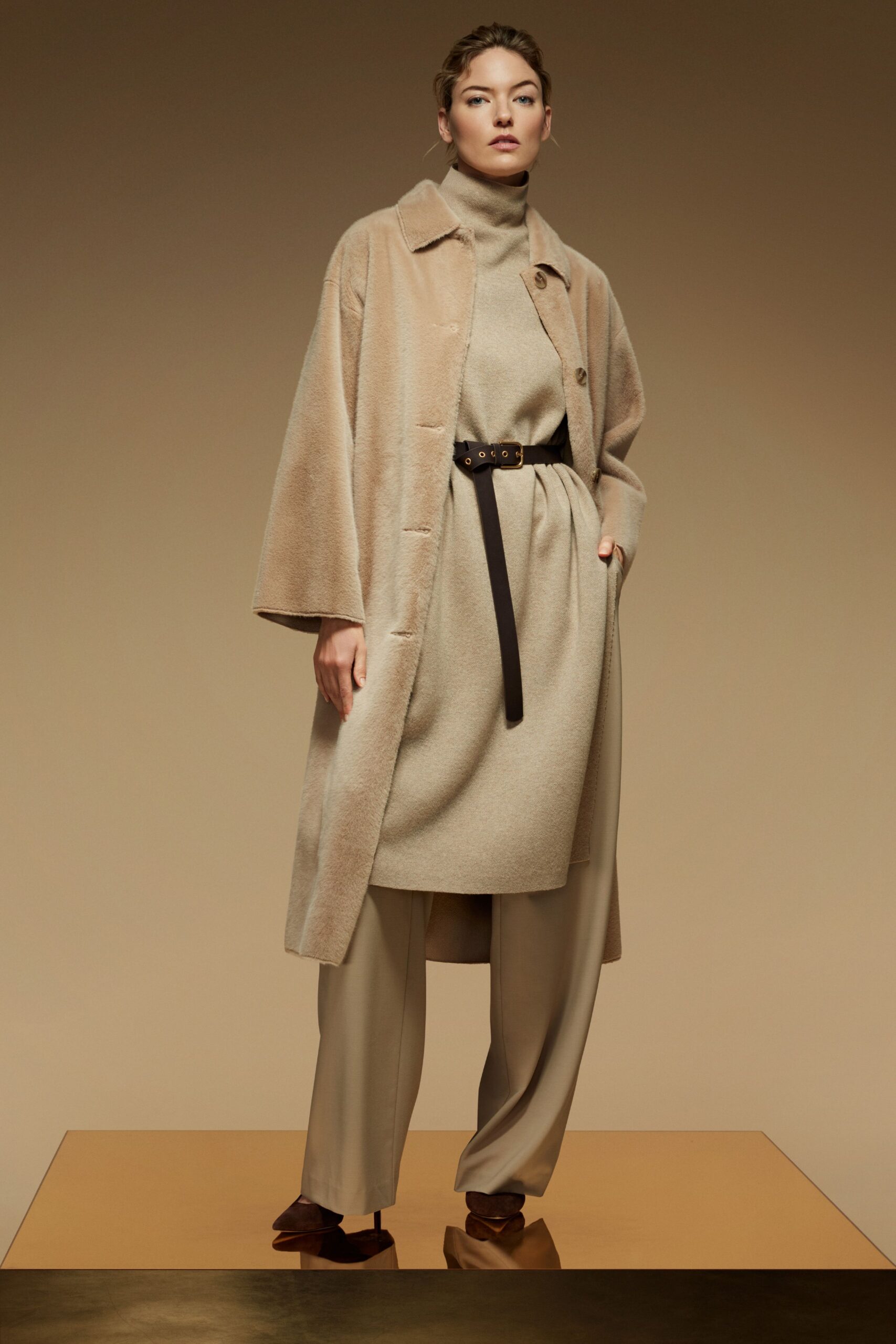 beige faux-fur coat with gray top