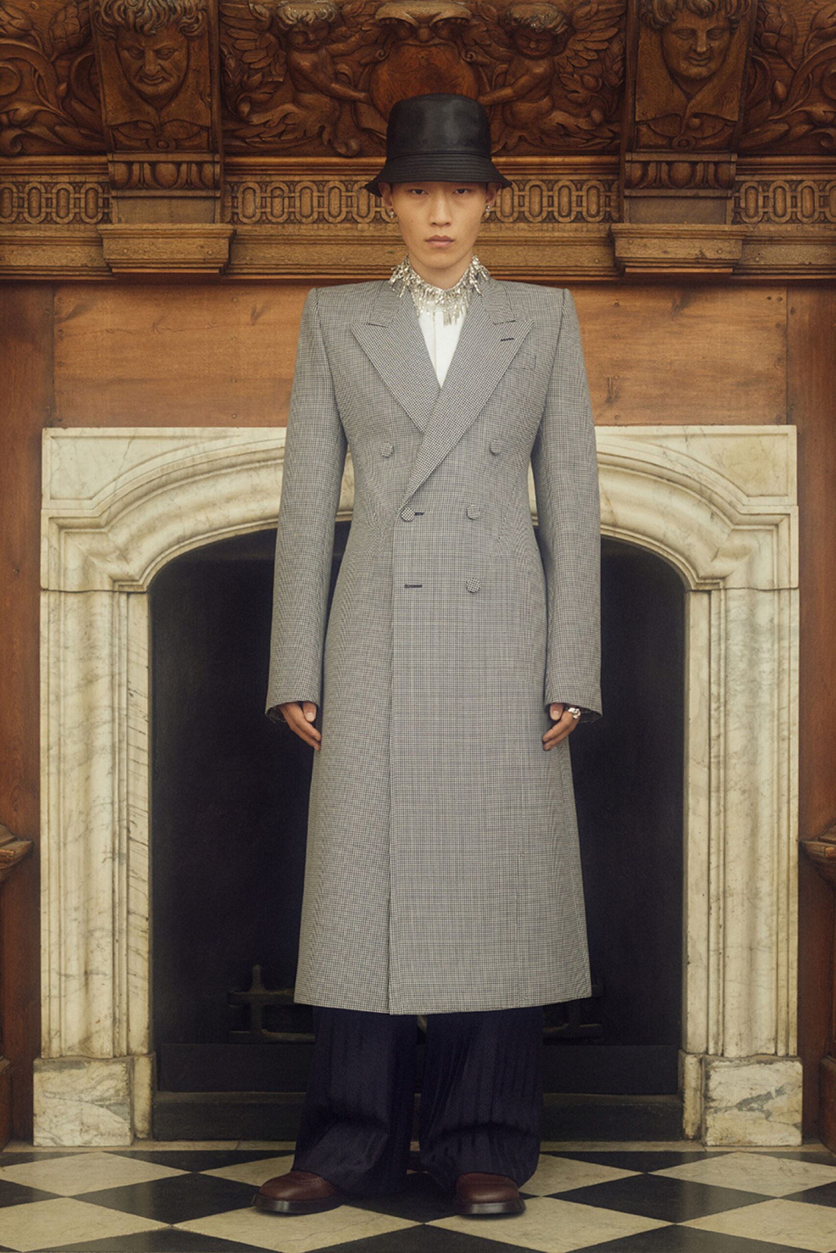 gray tailored coat with black pants