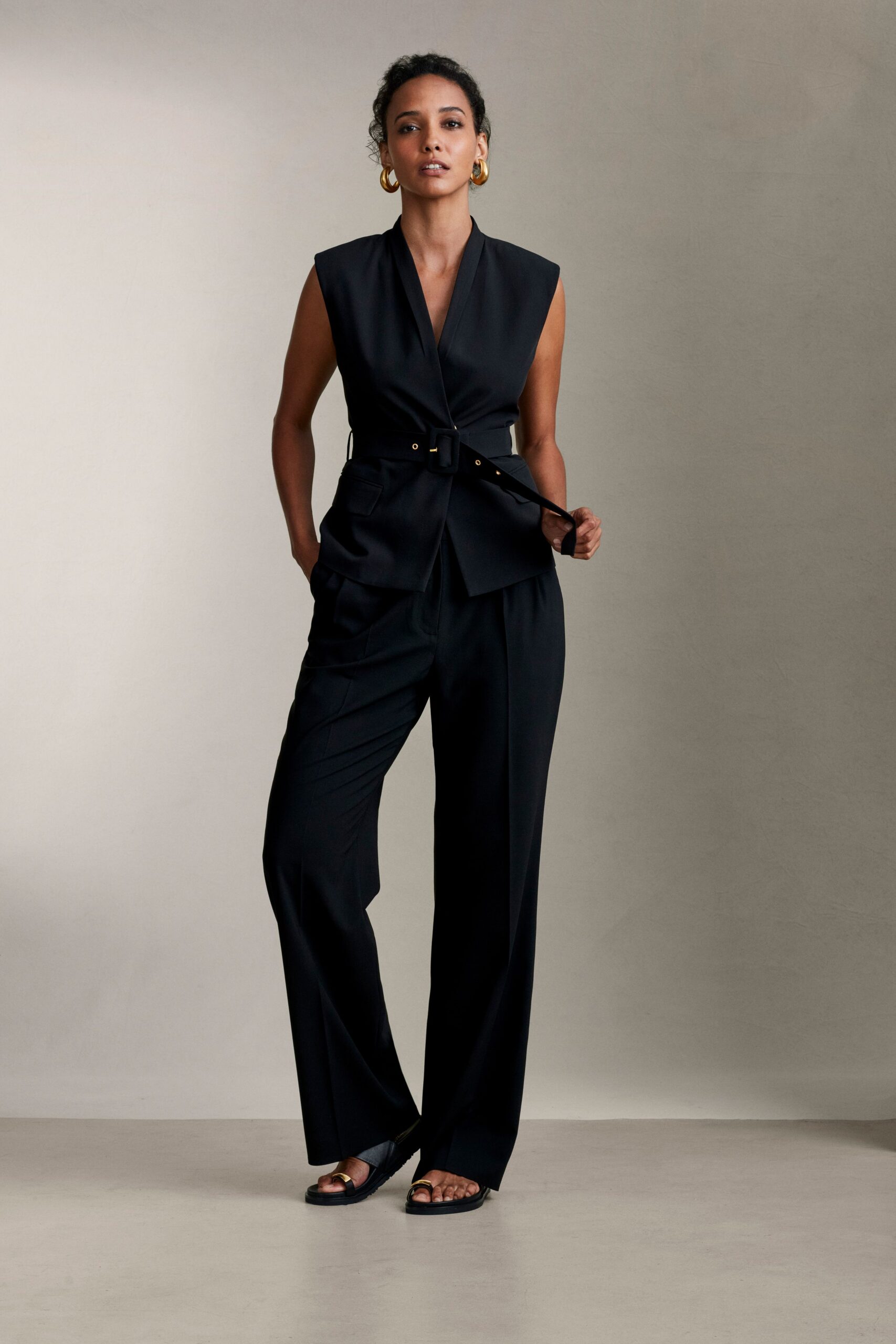 black cotton sleeveless collared tailored belted suit