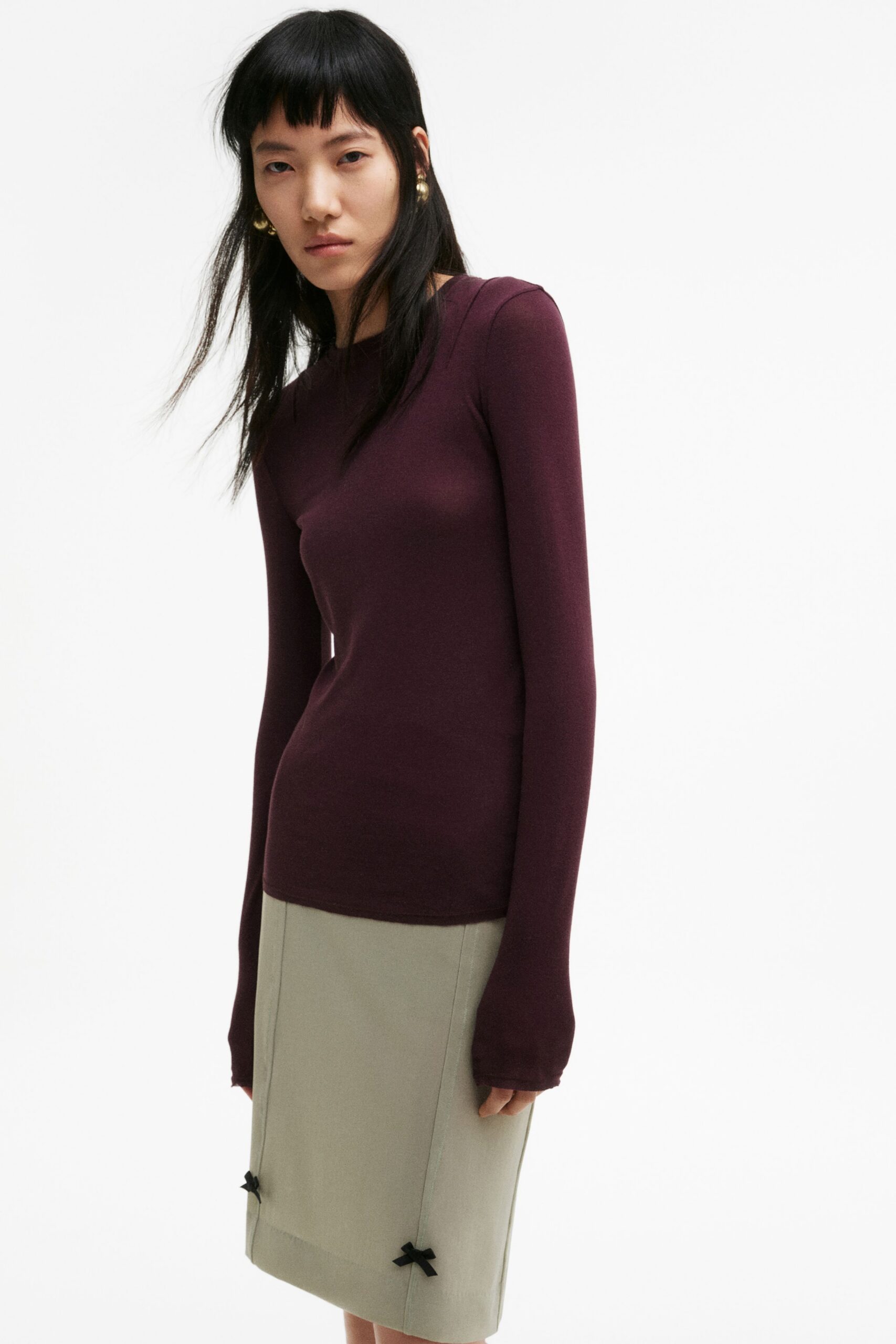fitted purple top and beige pencil skirt