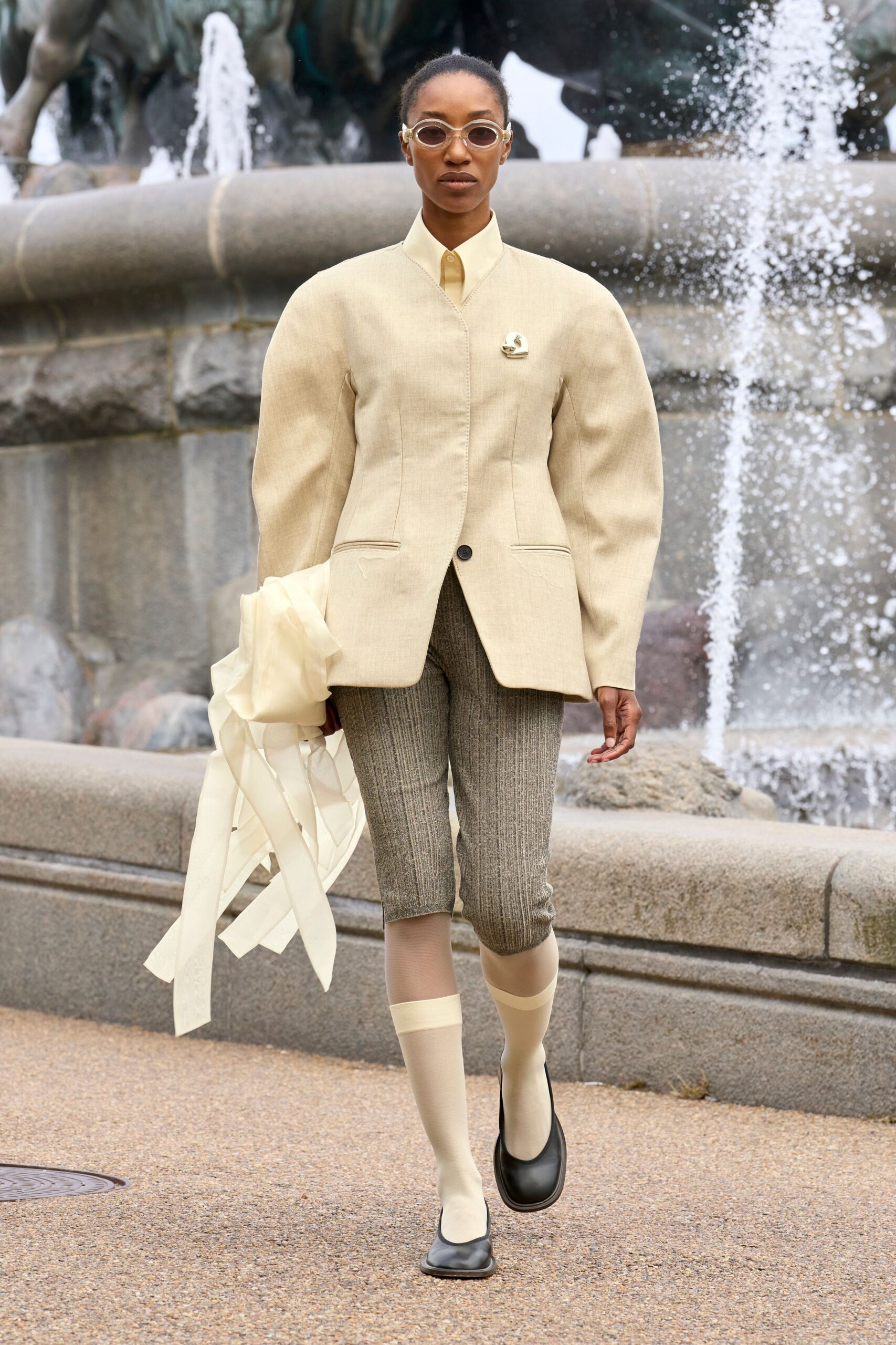 beige structured blazer with gray pants