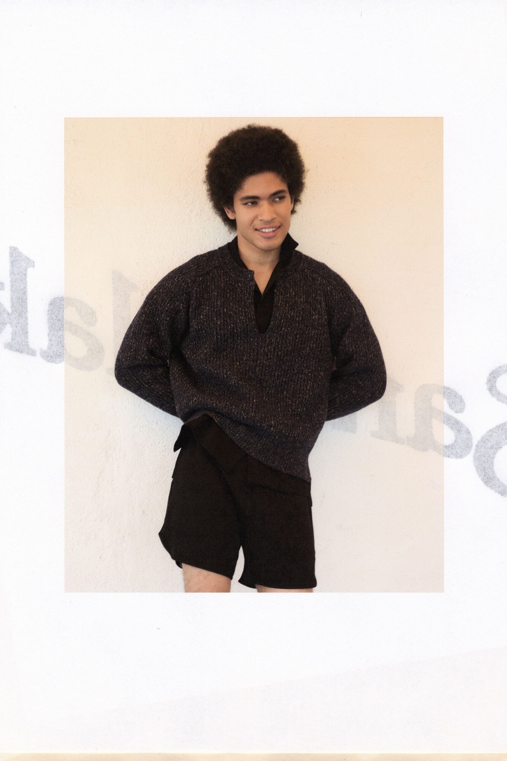 black wool long-sleeve collared relaxed textured sweater