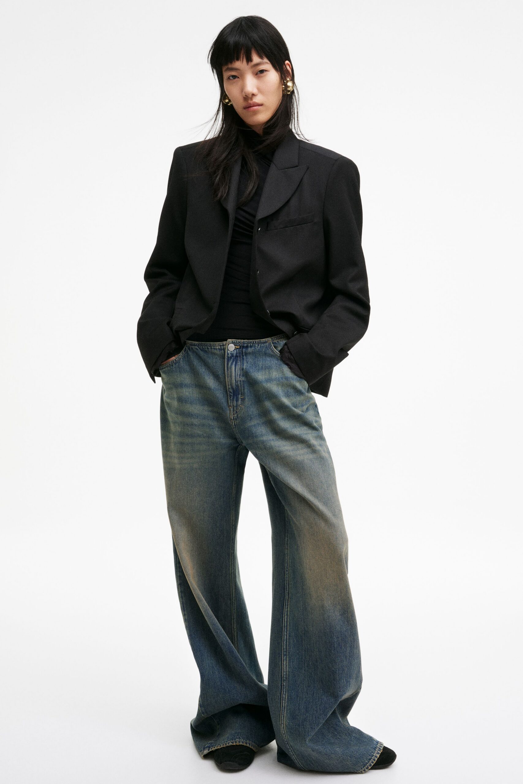 black blazer with fitted top and wide-leg jeans