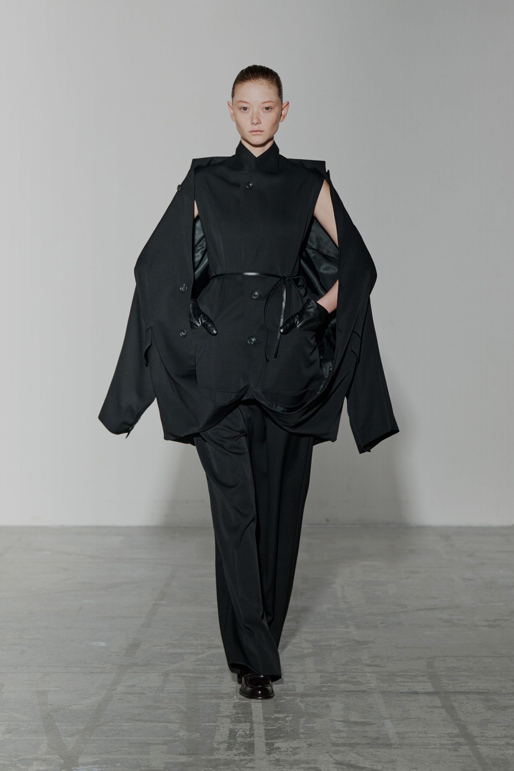 black cotton long-sleeve collared oversized buttoned draped jacket