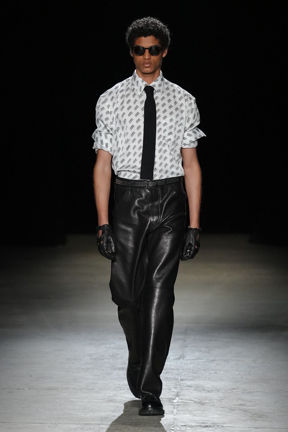 relaxed white printed shirt with black leather pants