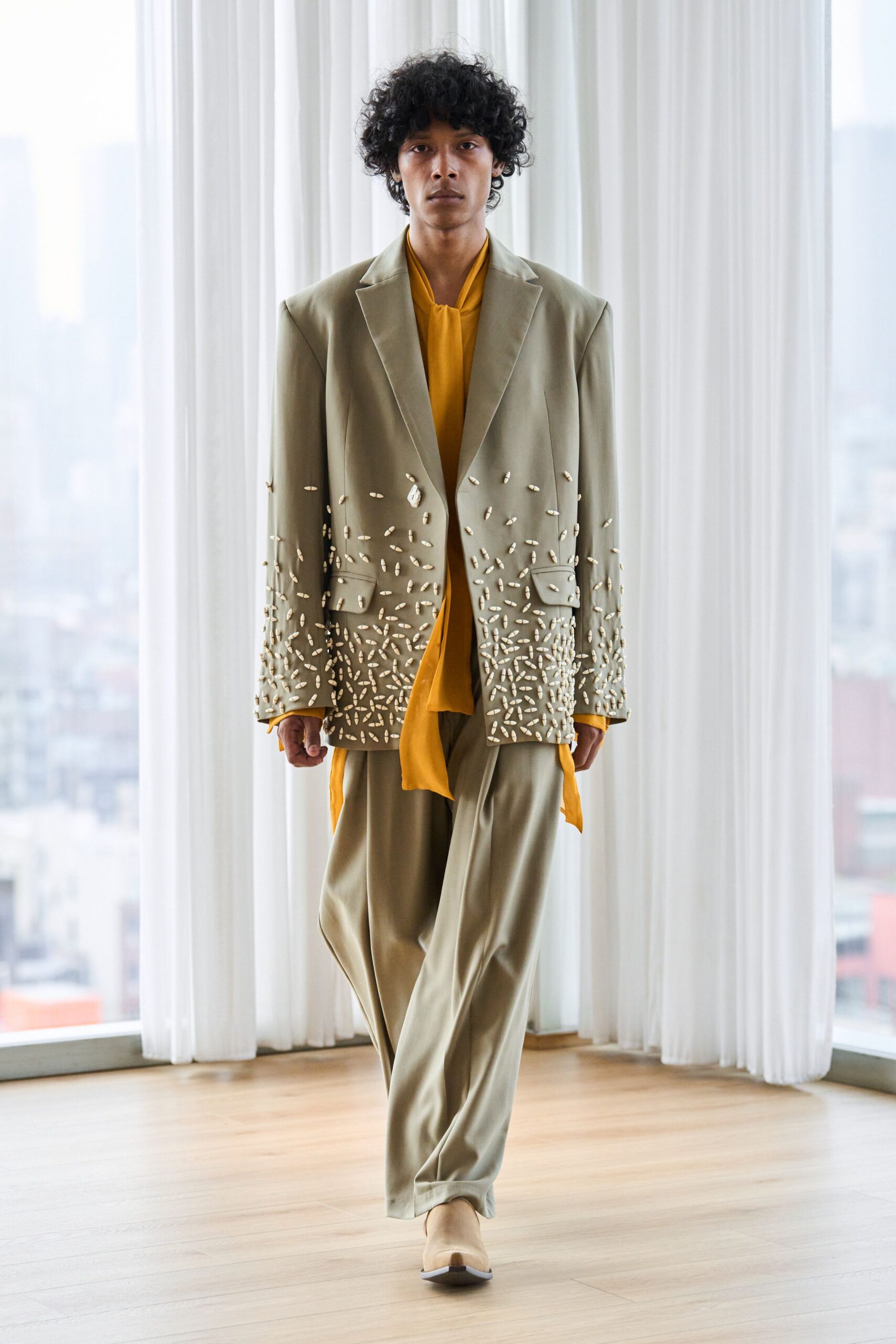 beige silk suit with yellow shirt