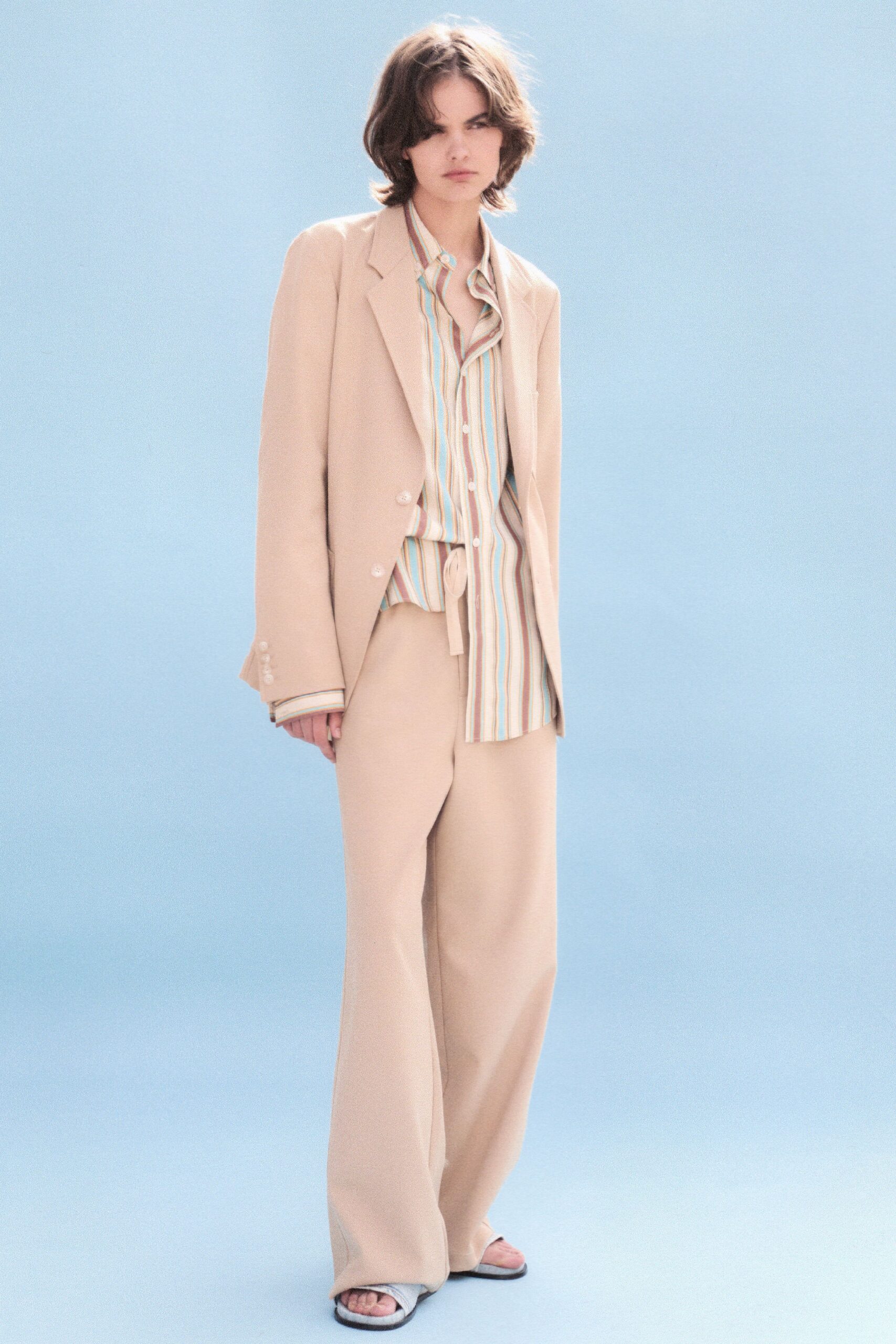 beige tailored blazer with striped shirt
