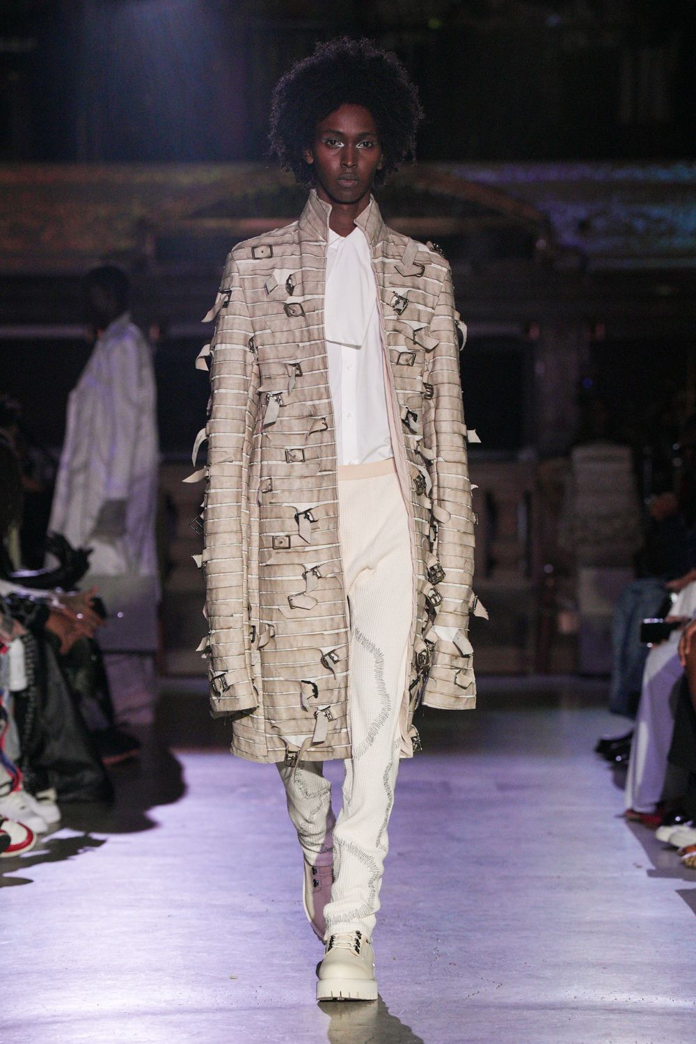 beige relaxed coat with white shirt and pants