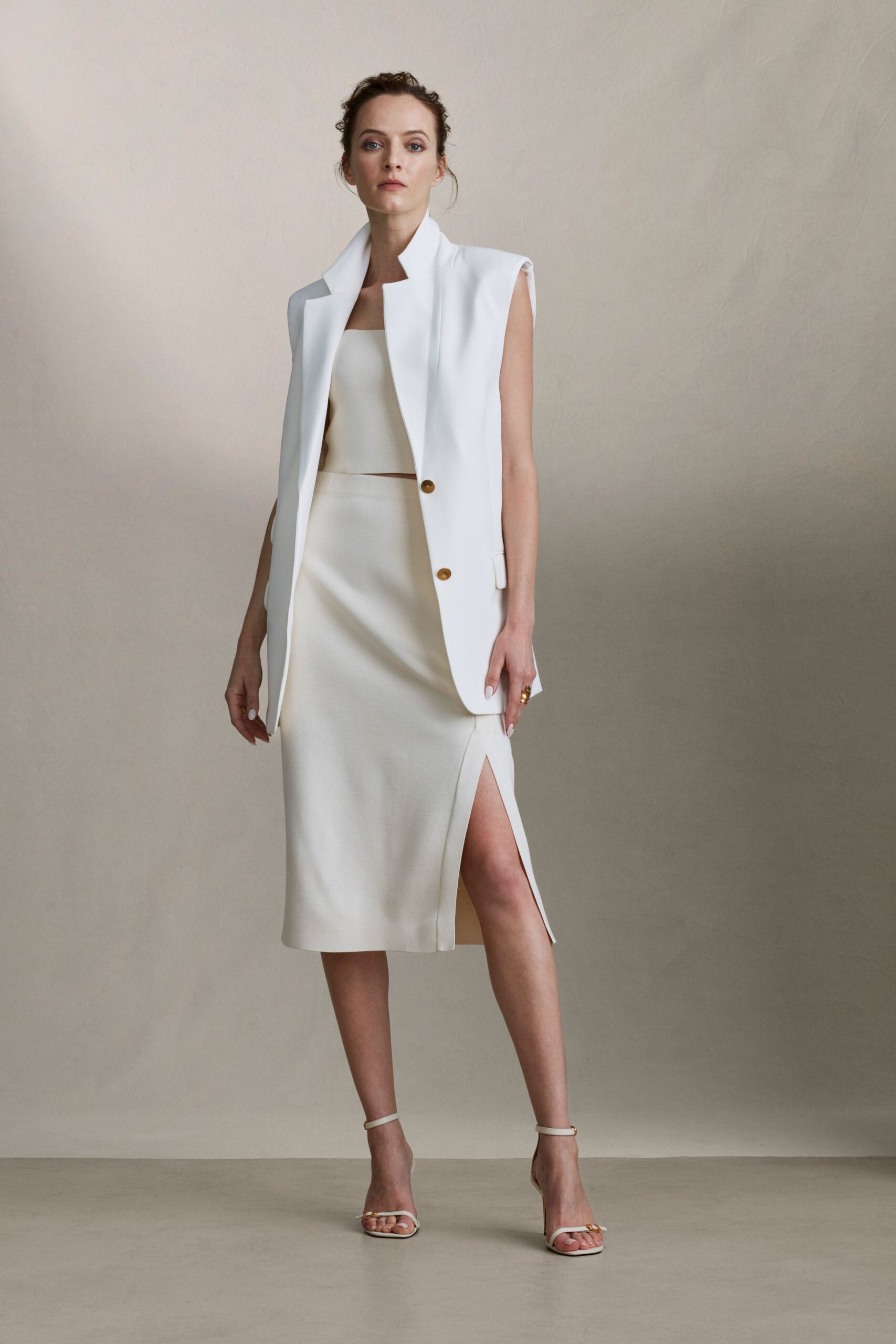 white cotton long-sleeve collared structured buttoned blazer