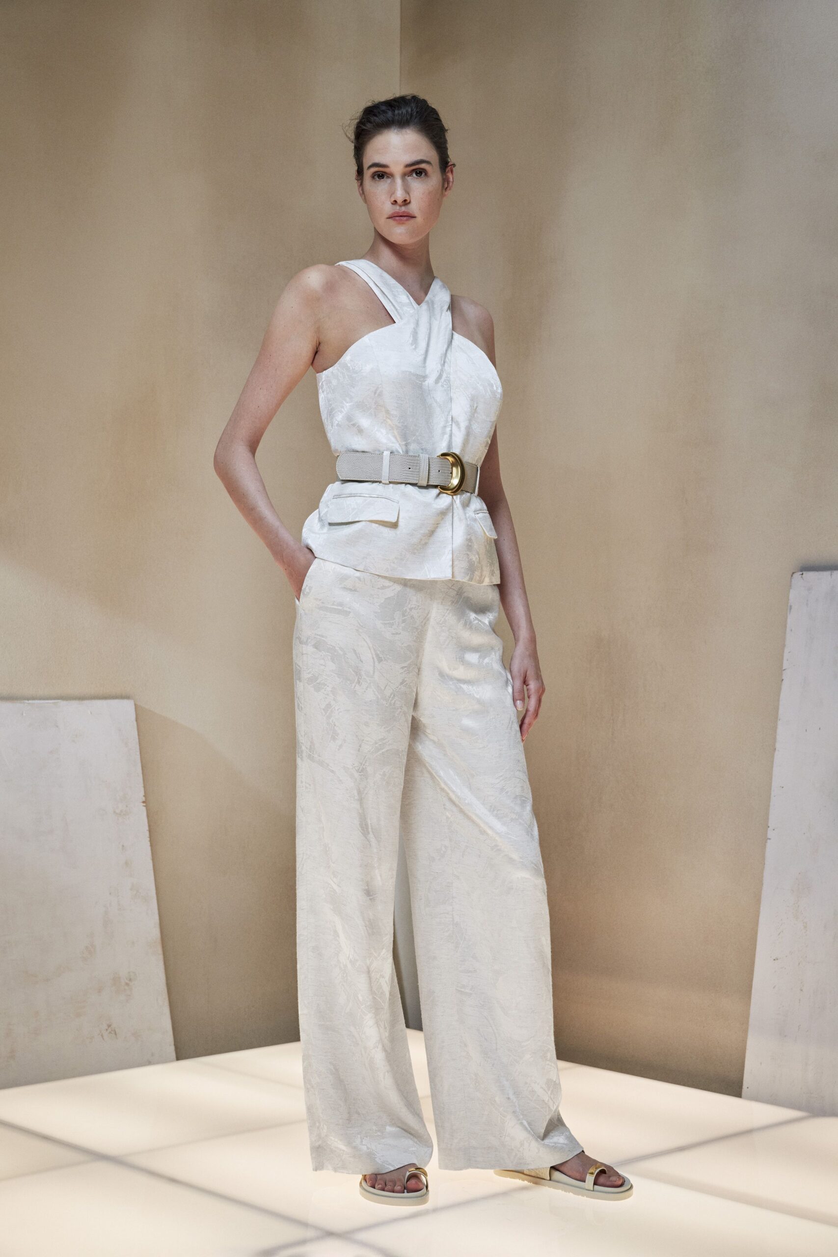 white silk halter top and wide-leg pants