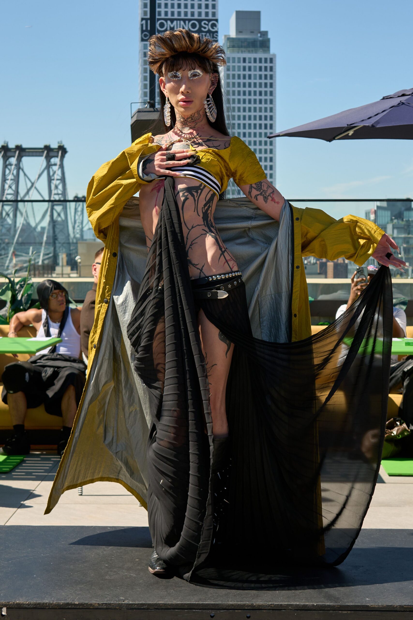 yellow oversized coat and black skirt