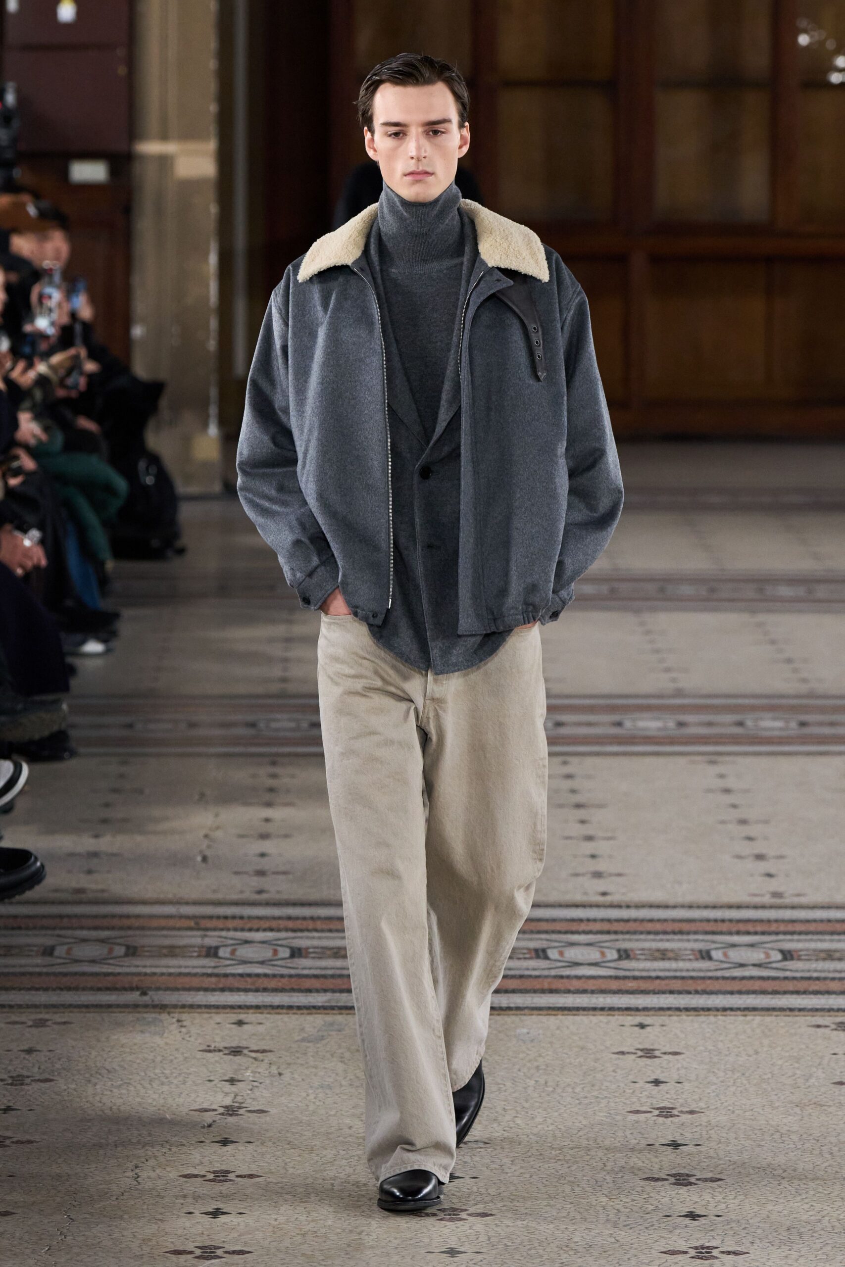 gray jacket with turtleneck and beige pants