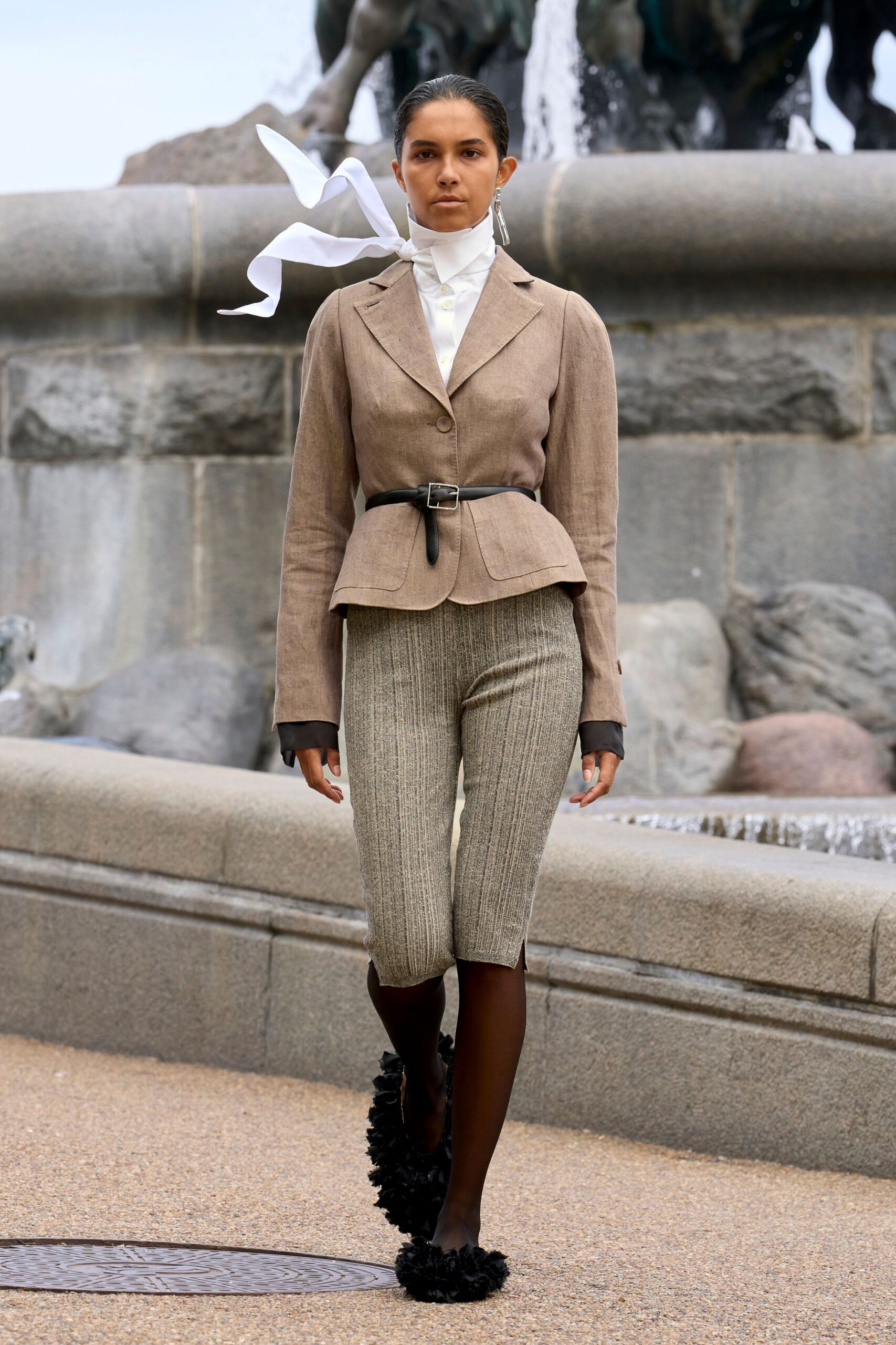 beige tailored blazer with gray striped pants