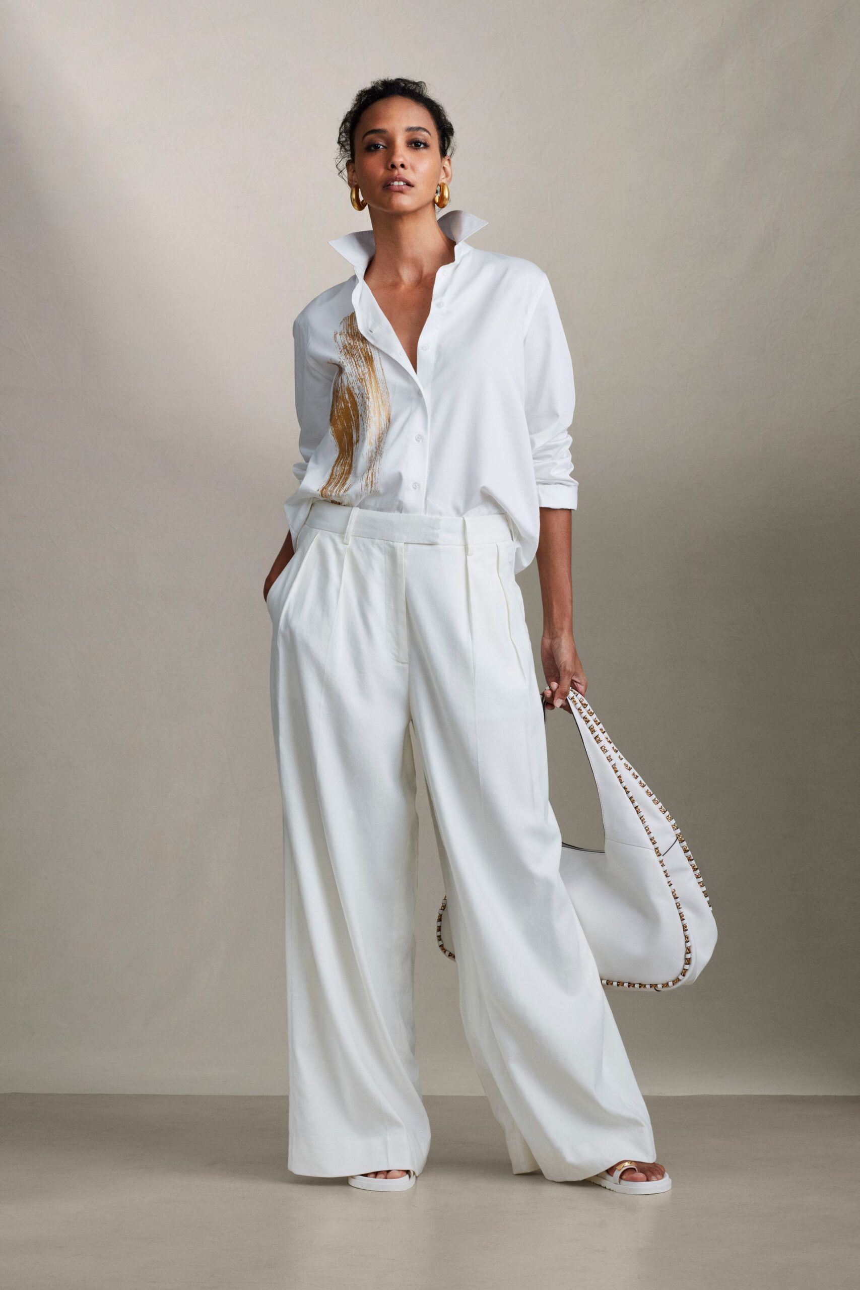 white relaxed shirt and pants