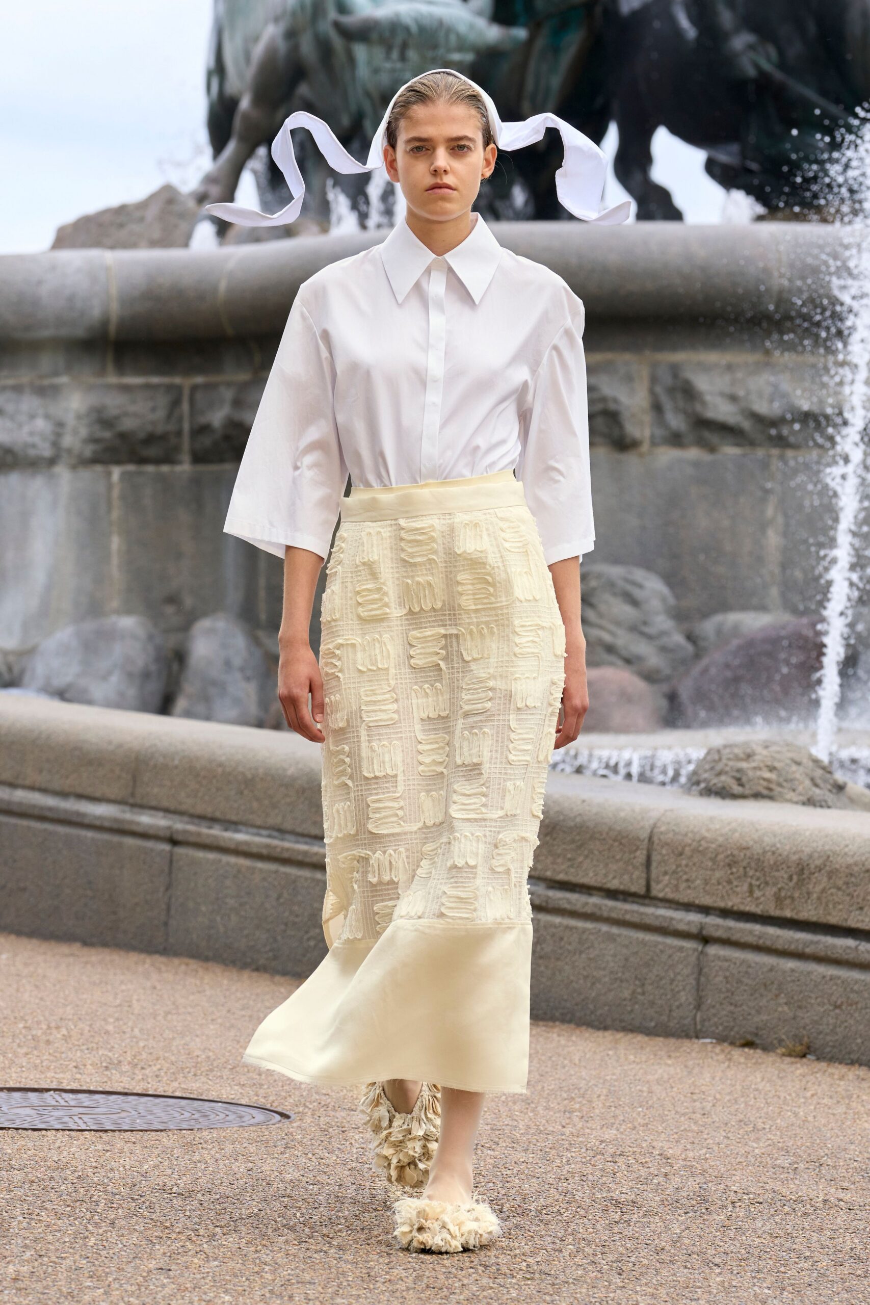 white shirt beige pleated skirt