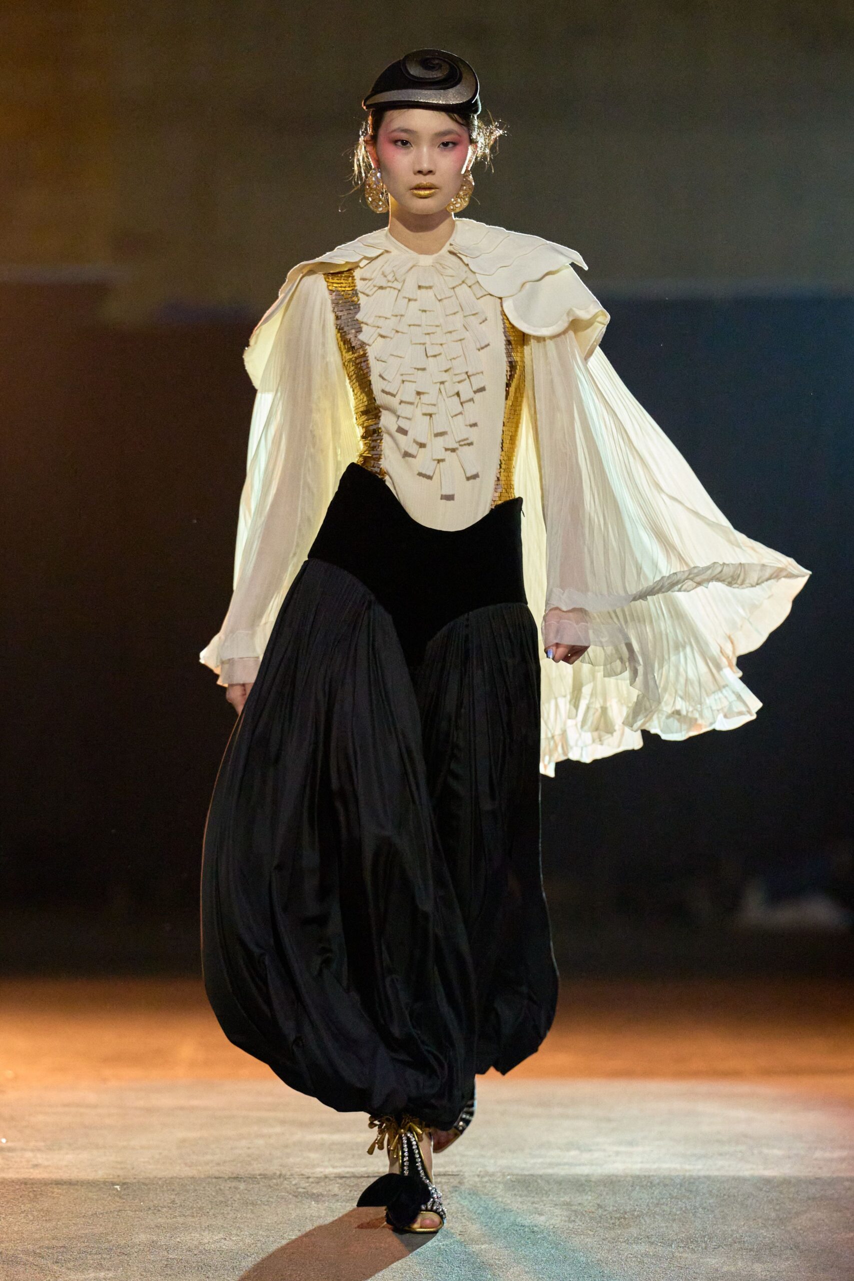 white silk blouse with gold details