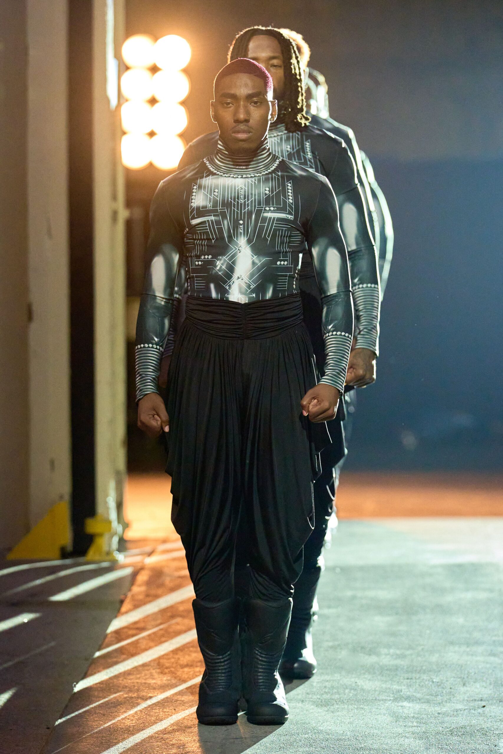 black neoprene jumpsuit with pleated pants