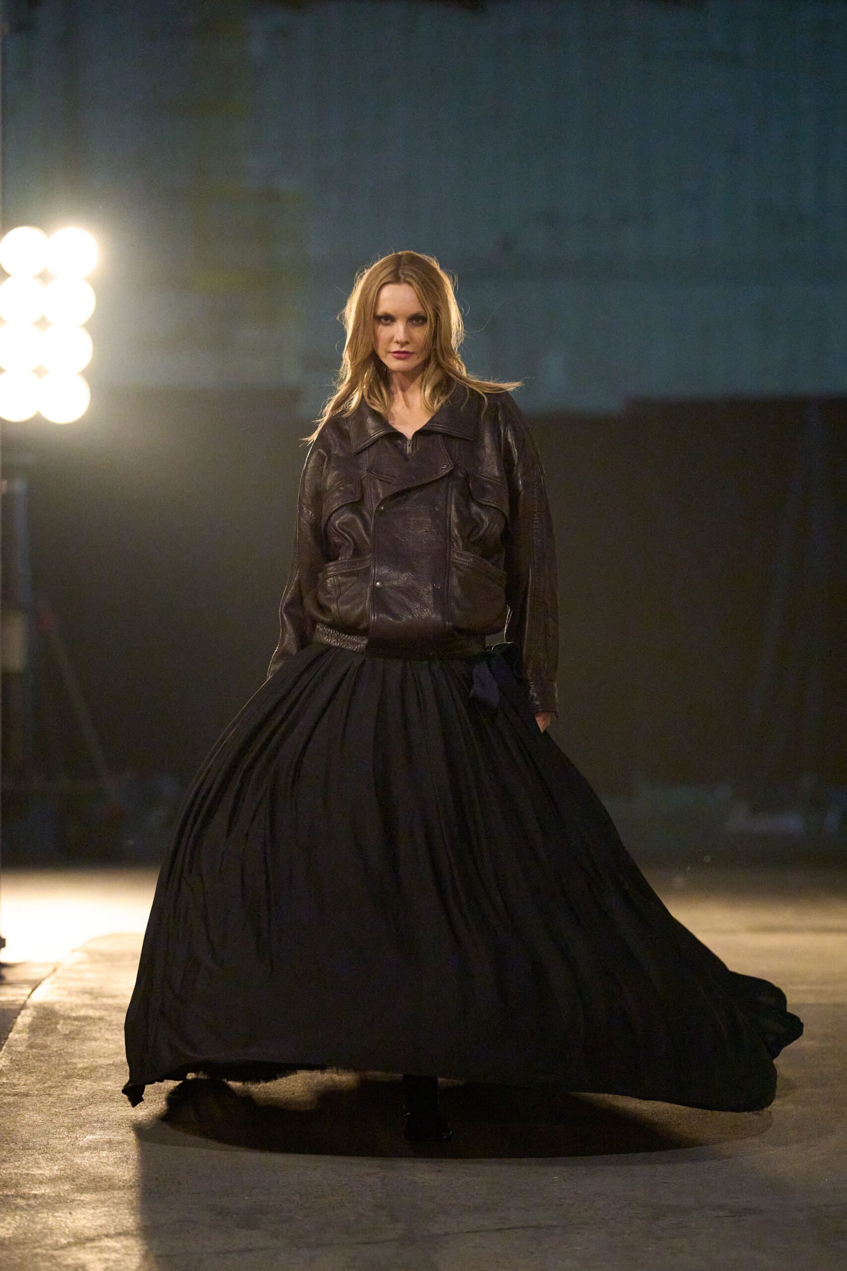 brown leather fitted jacket and black pleated maxi skirt