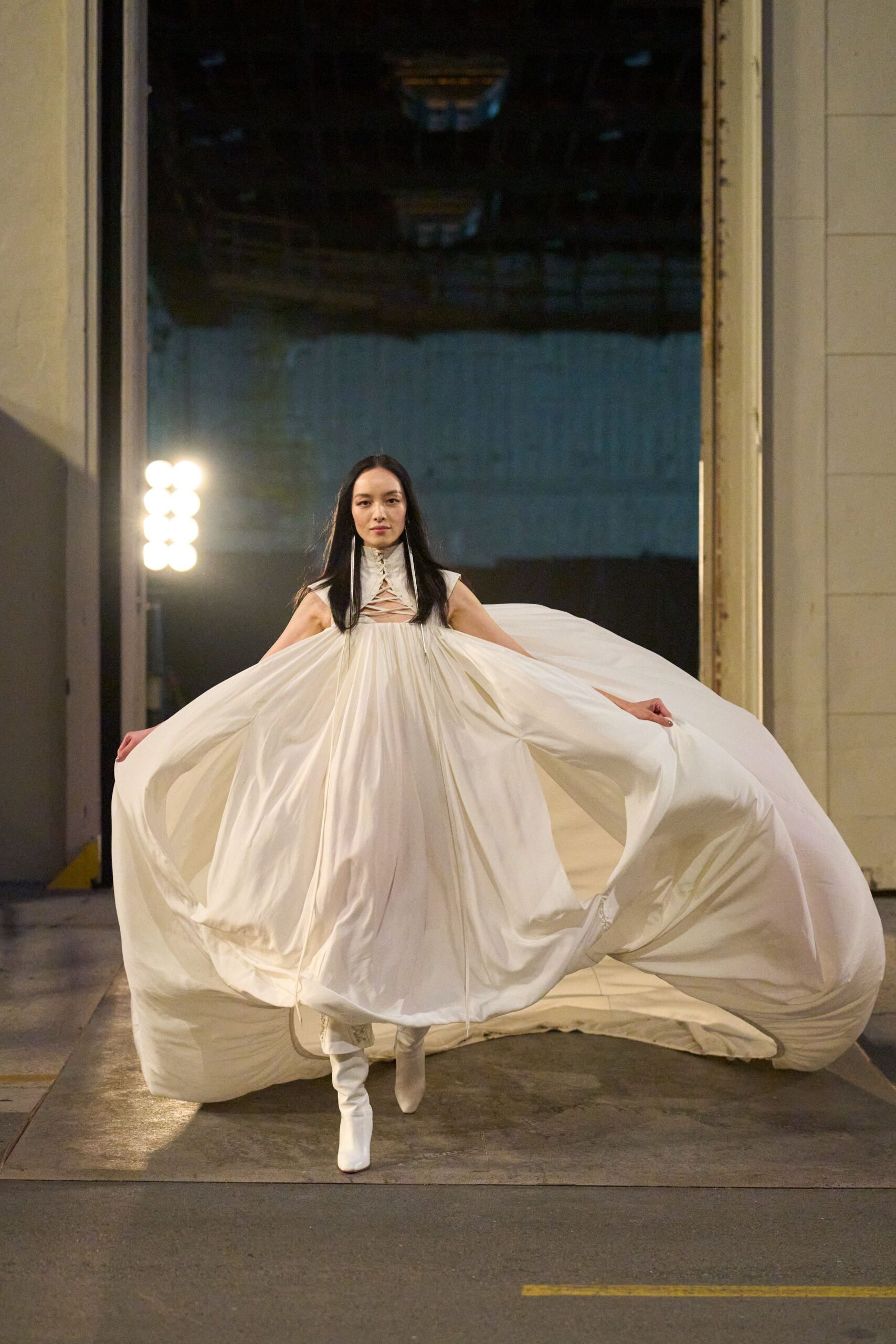 white silk sleeveless gown with boots