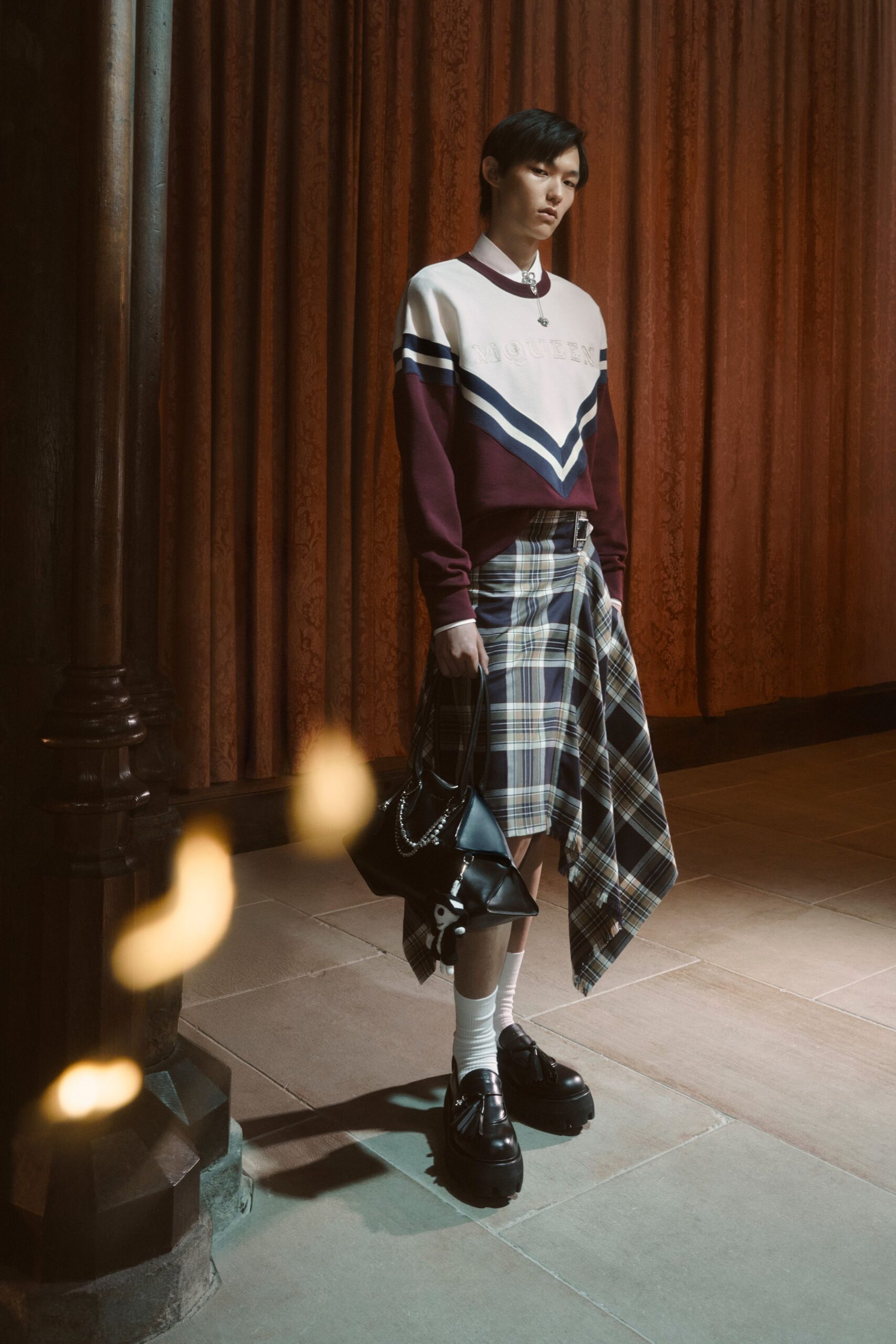 maroon color-blocked sweater with plaid skirt