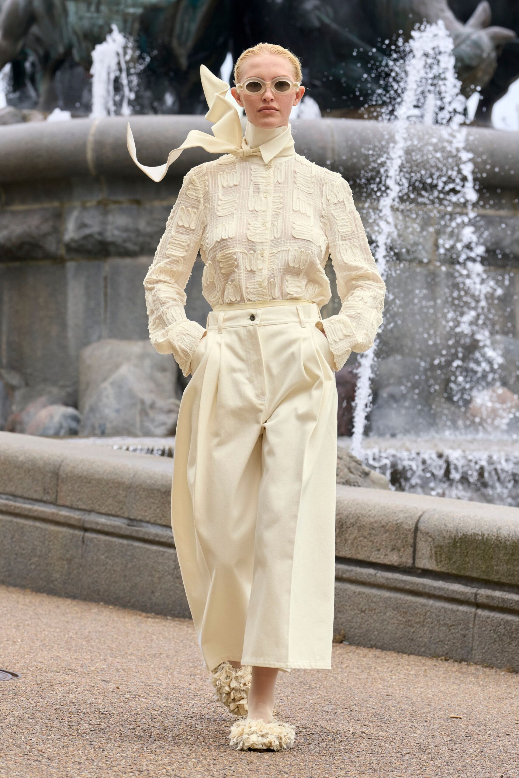 white embroidered blouse with beige pants