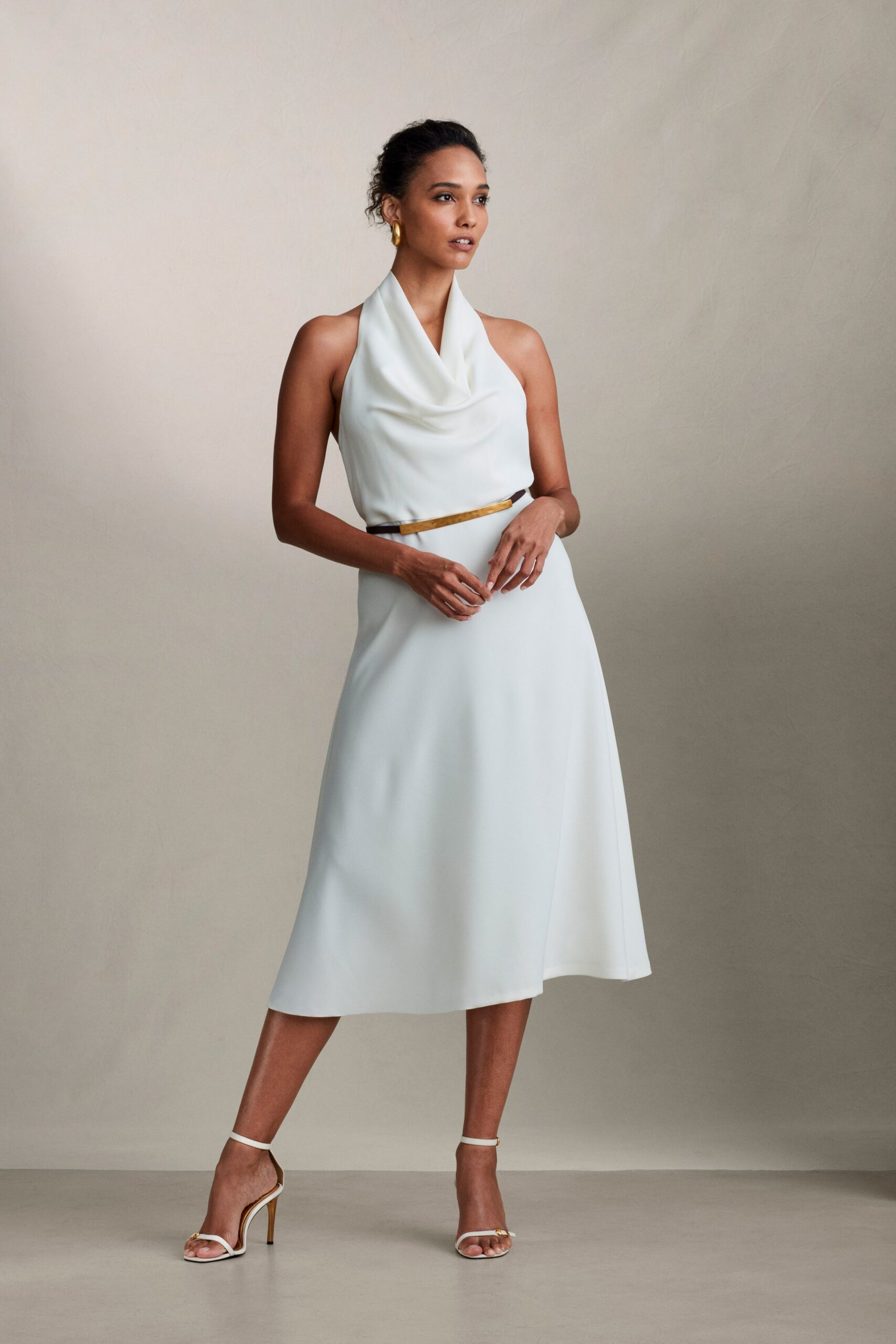 white silk sleeveless high-neck fitted draped belted dress