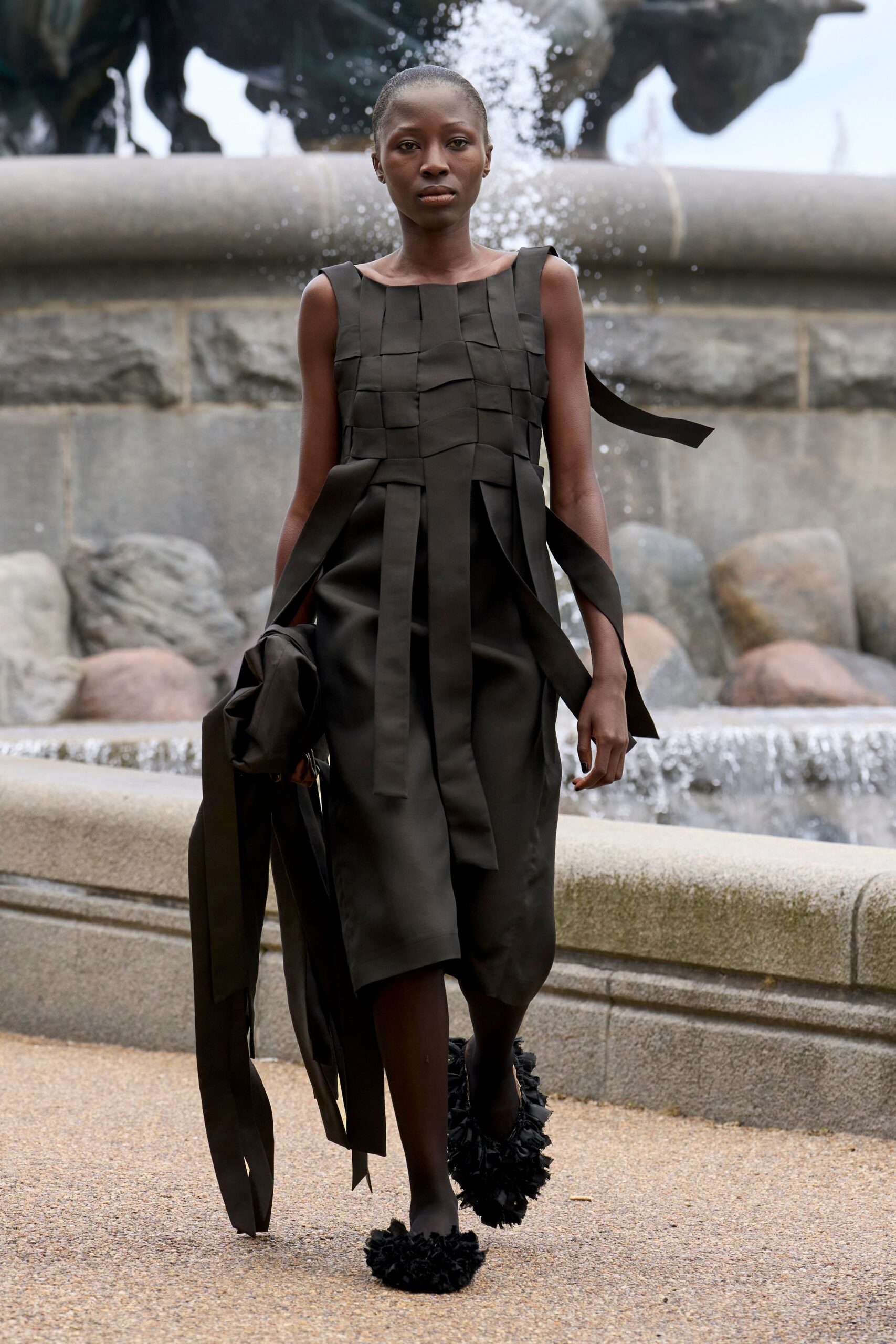 black pleated midi dress with ruffled shoes