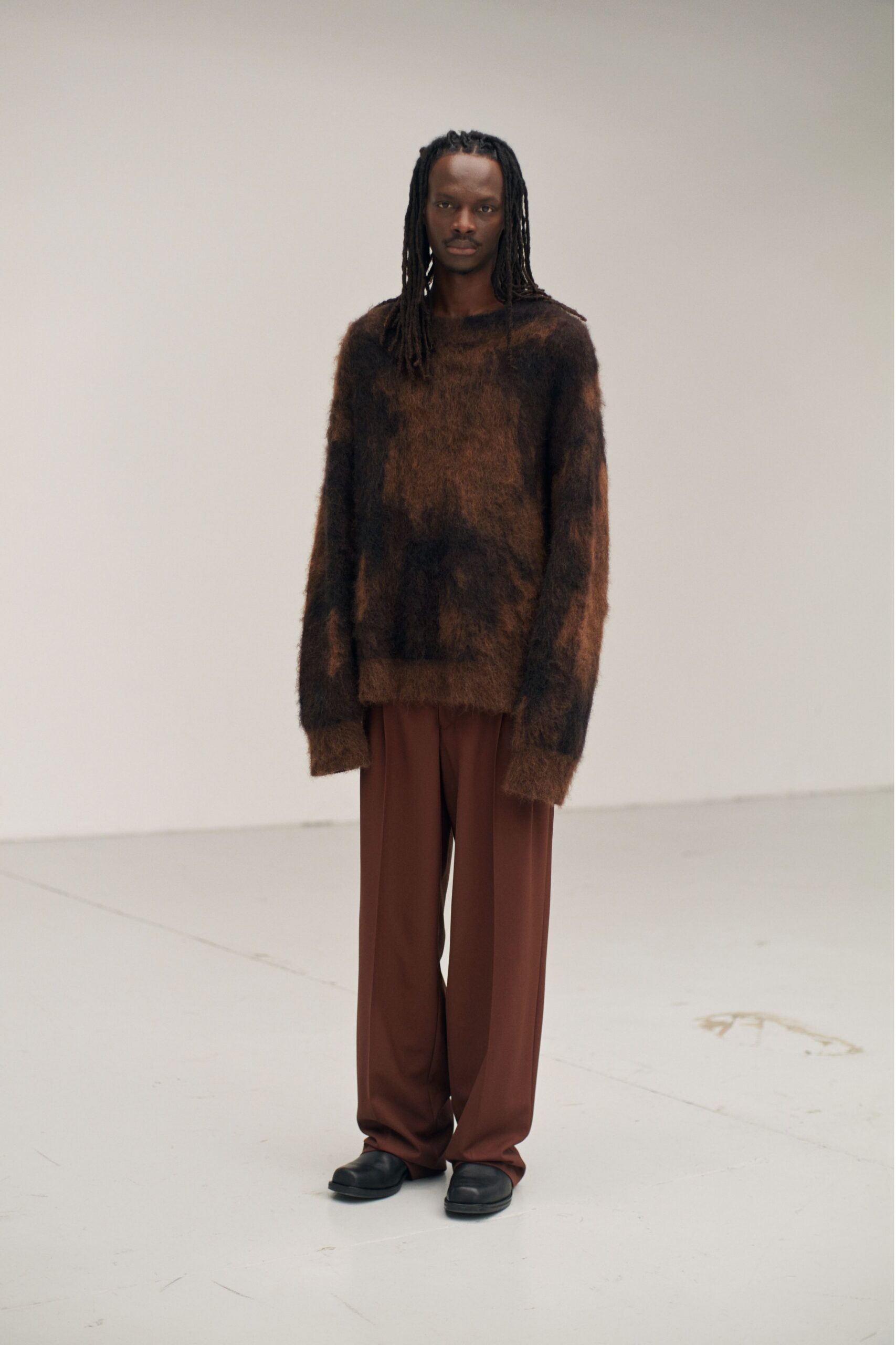 brown and black relaxed sweater with wide-leg pants