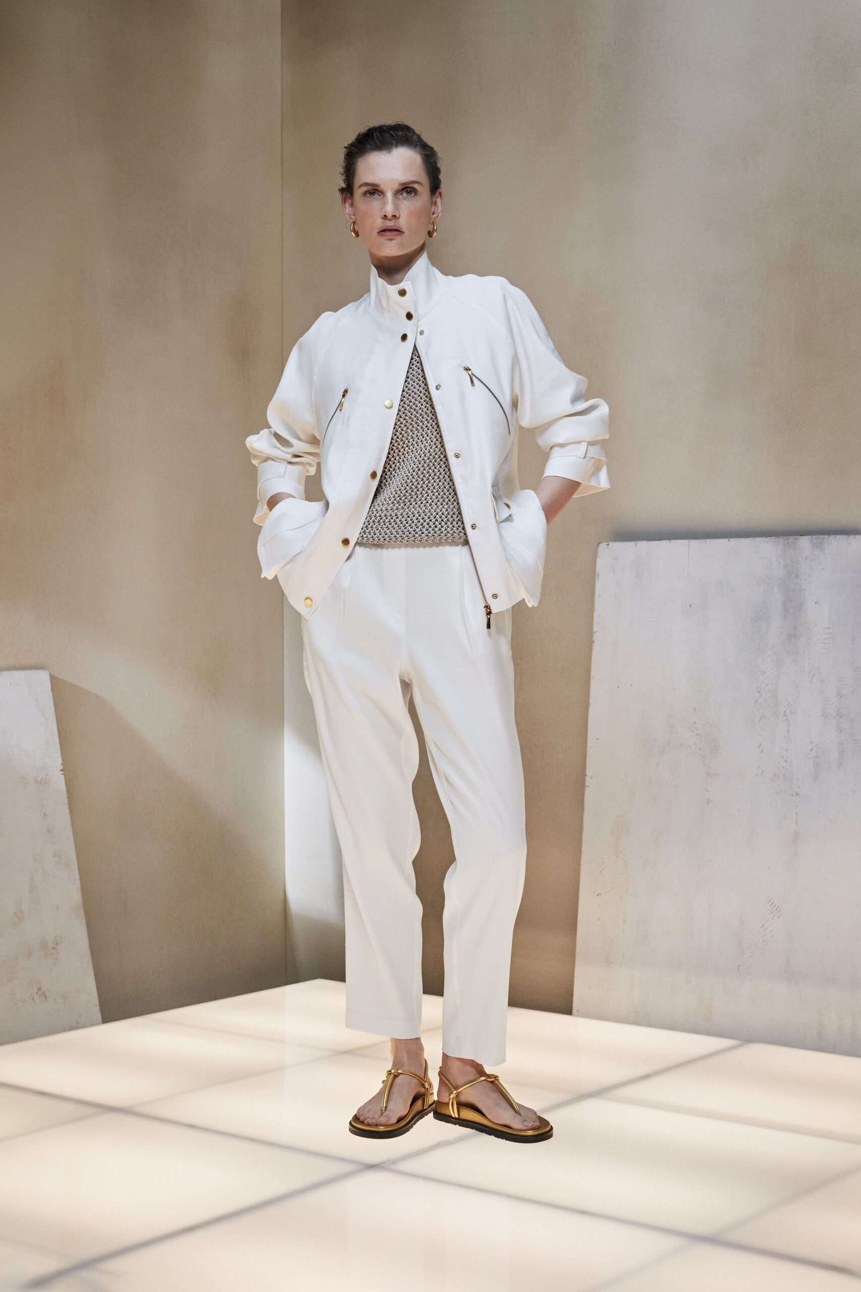 white jacket gray top tailored pants