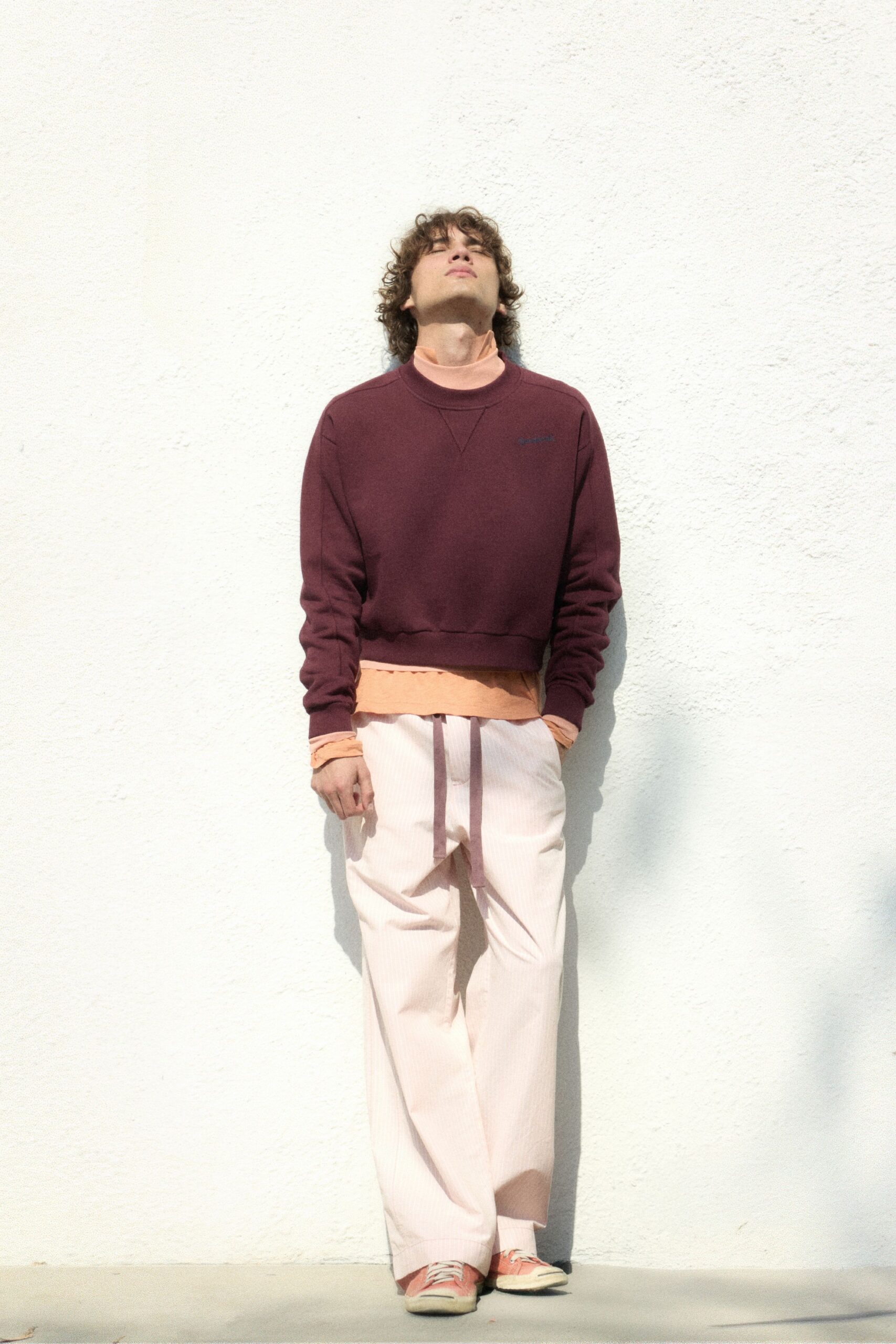 maroon sweater with striped pants