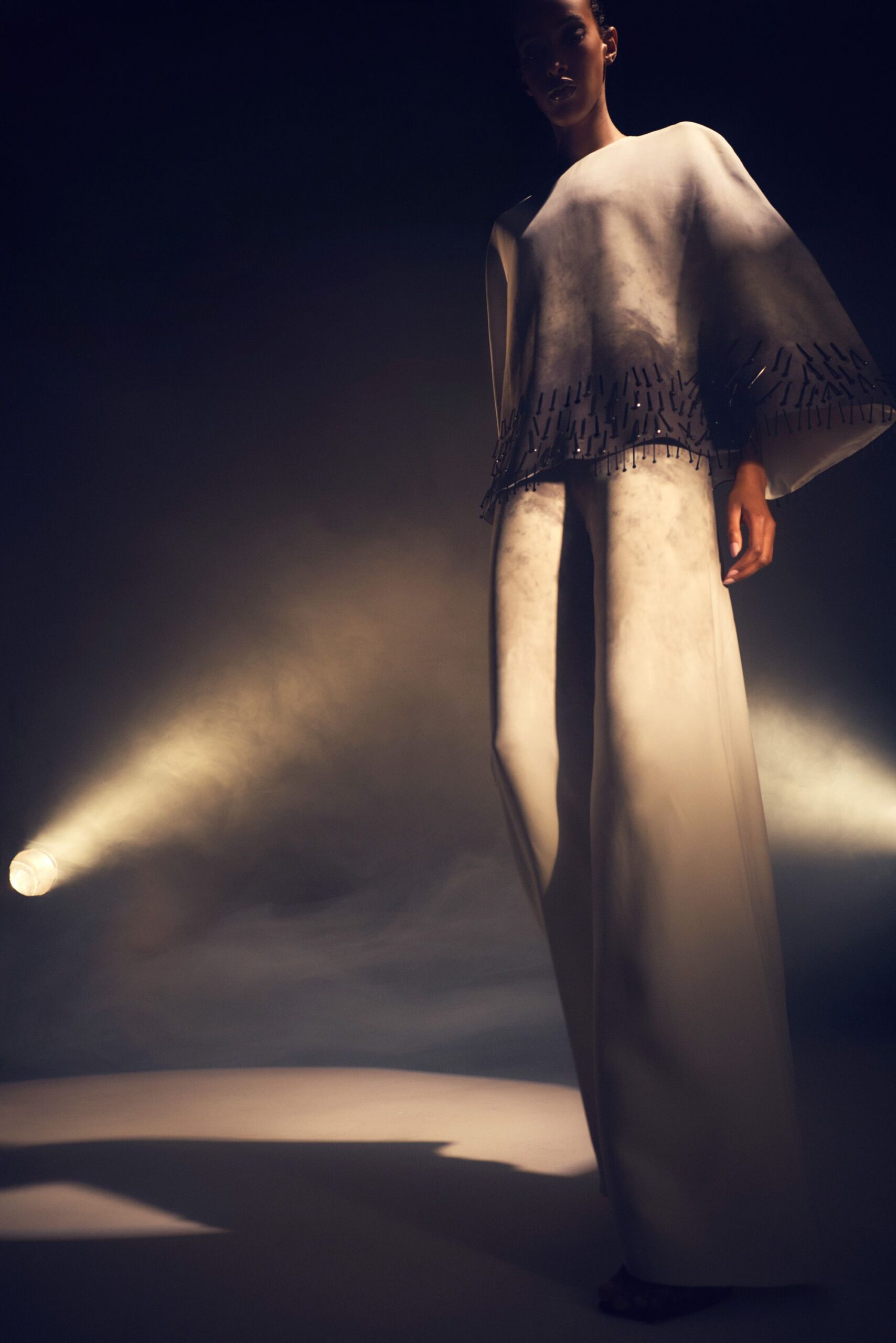white silk relaxed top and fitted pants