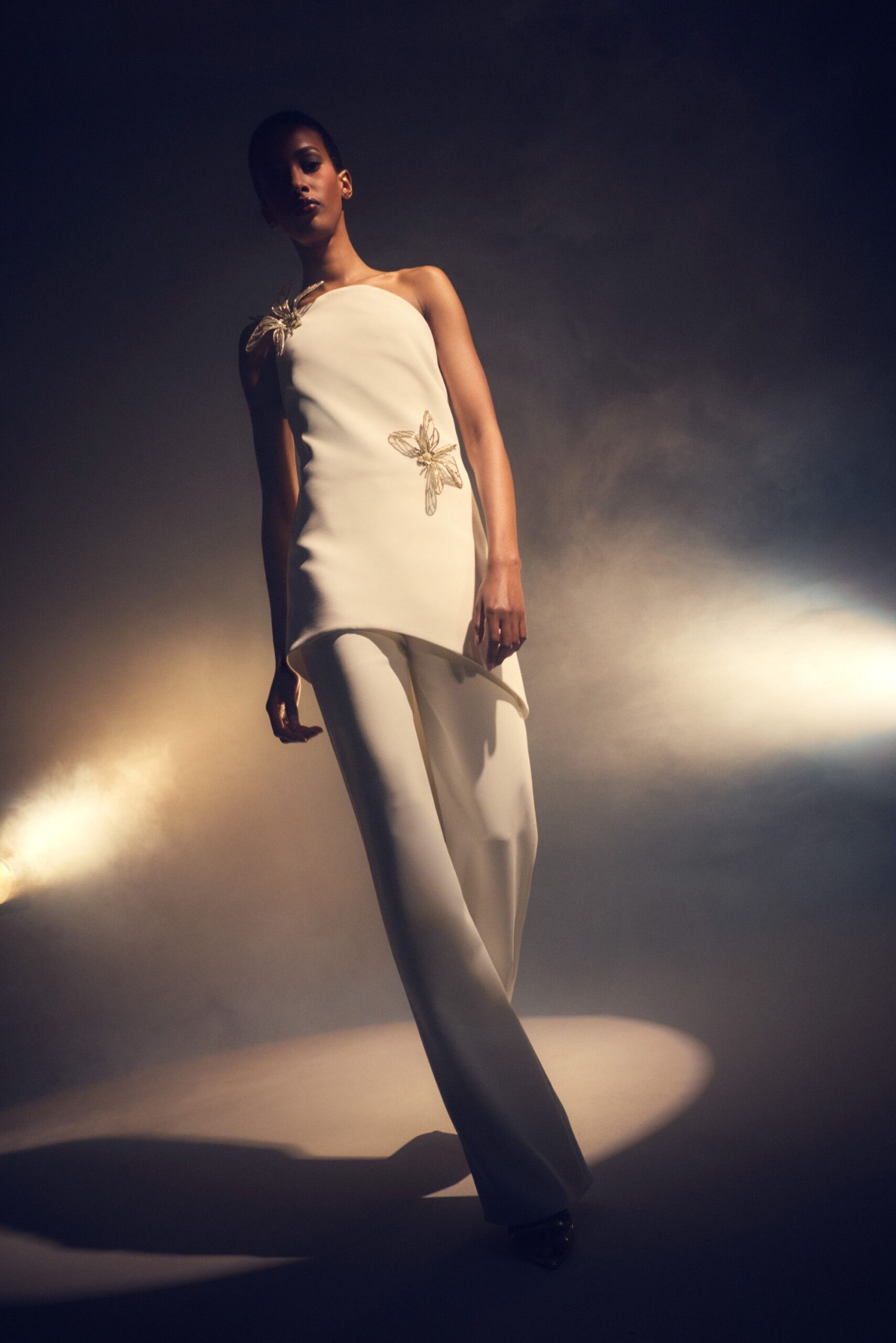 white silk sleeveless asymmetric fitted embellished top