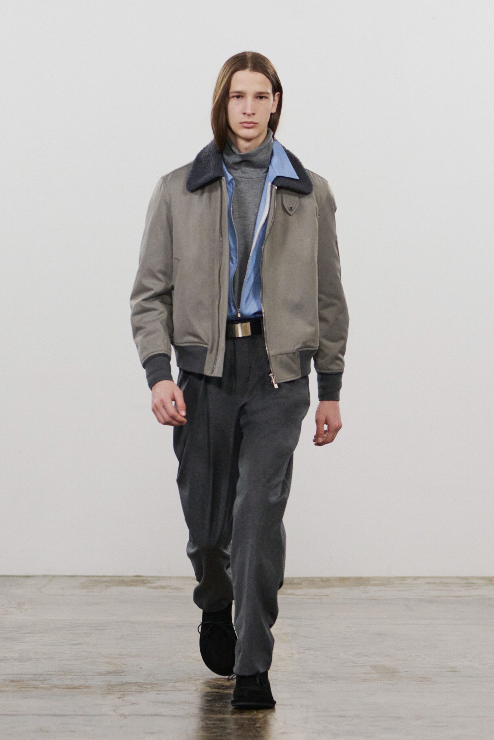gray jacket blue shirt gray pants