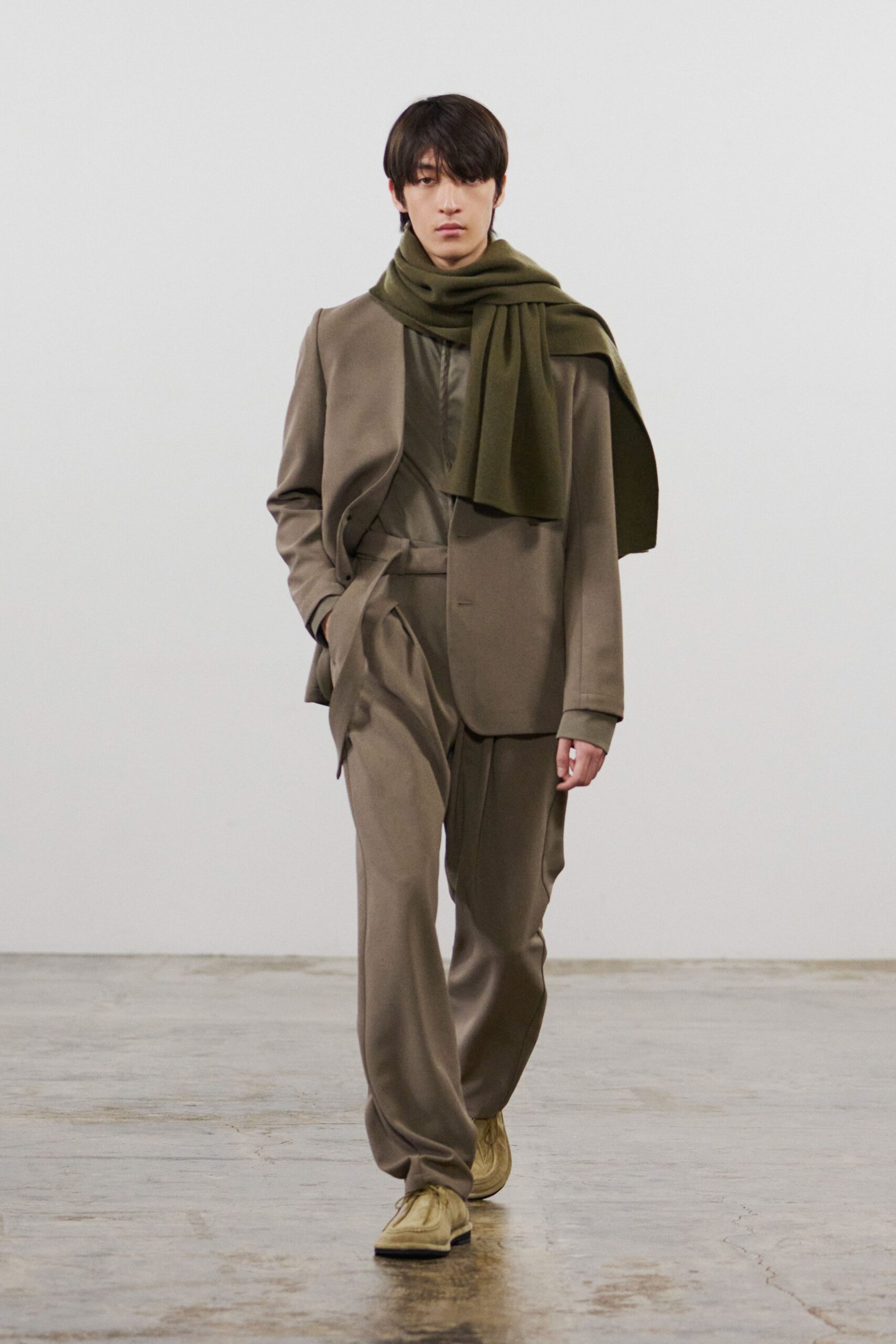 brown tailored suit with green scarf