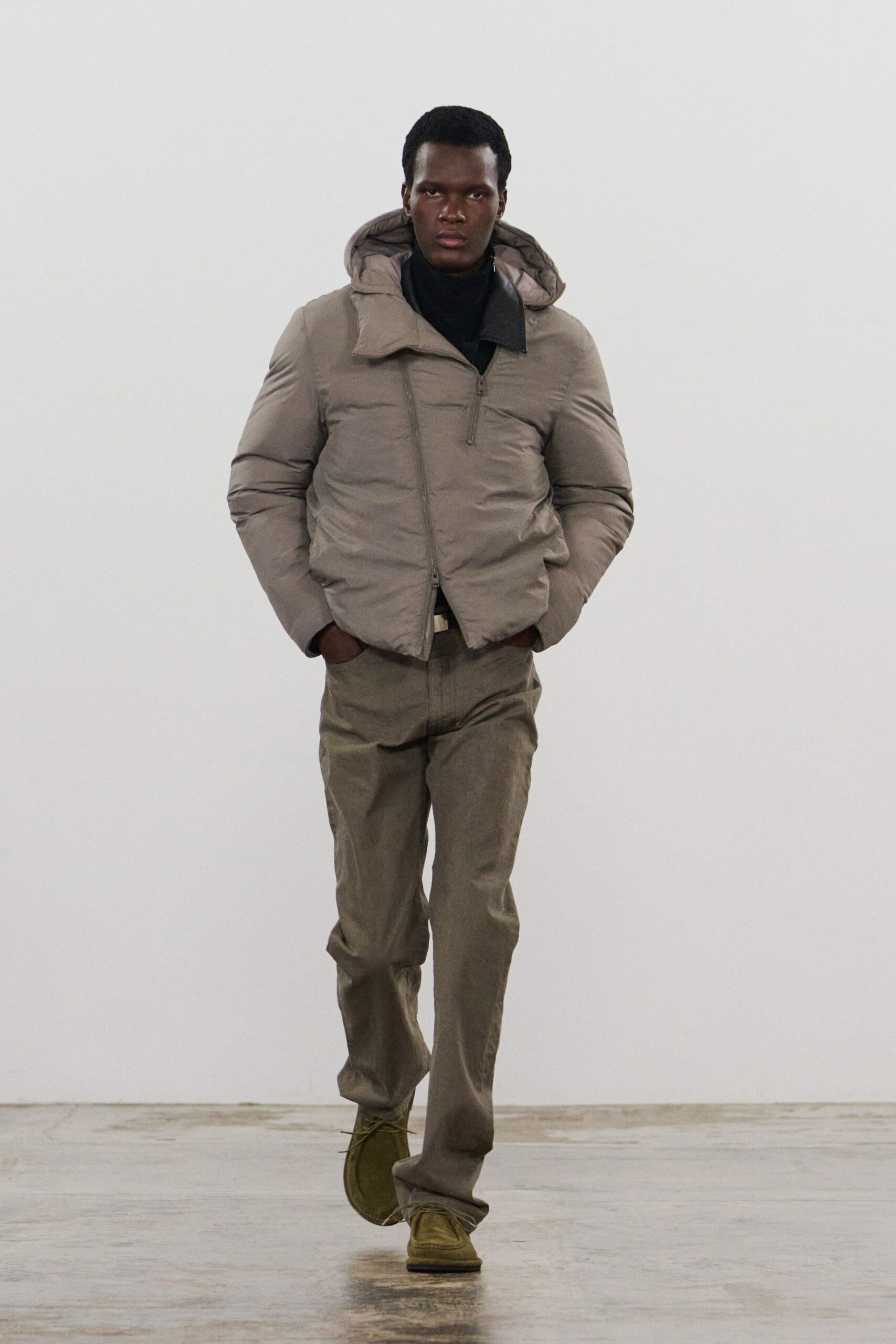 gray hooded jacket beige pants green shoes