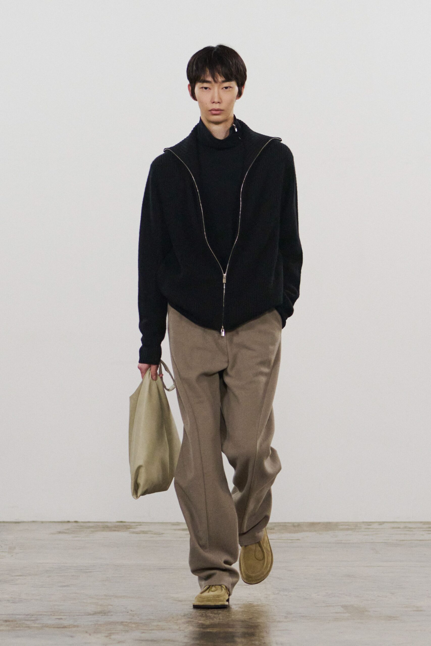 black hoodie beige pants tan shoes
