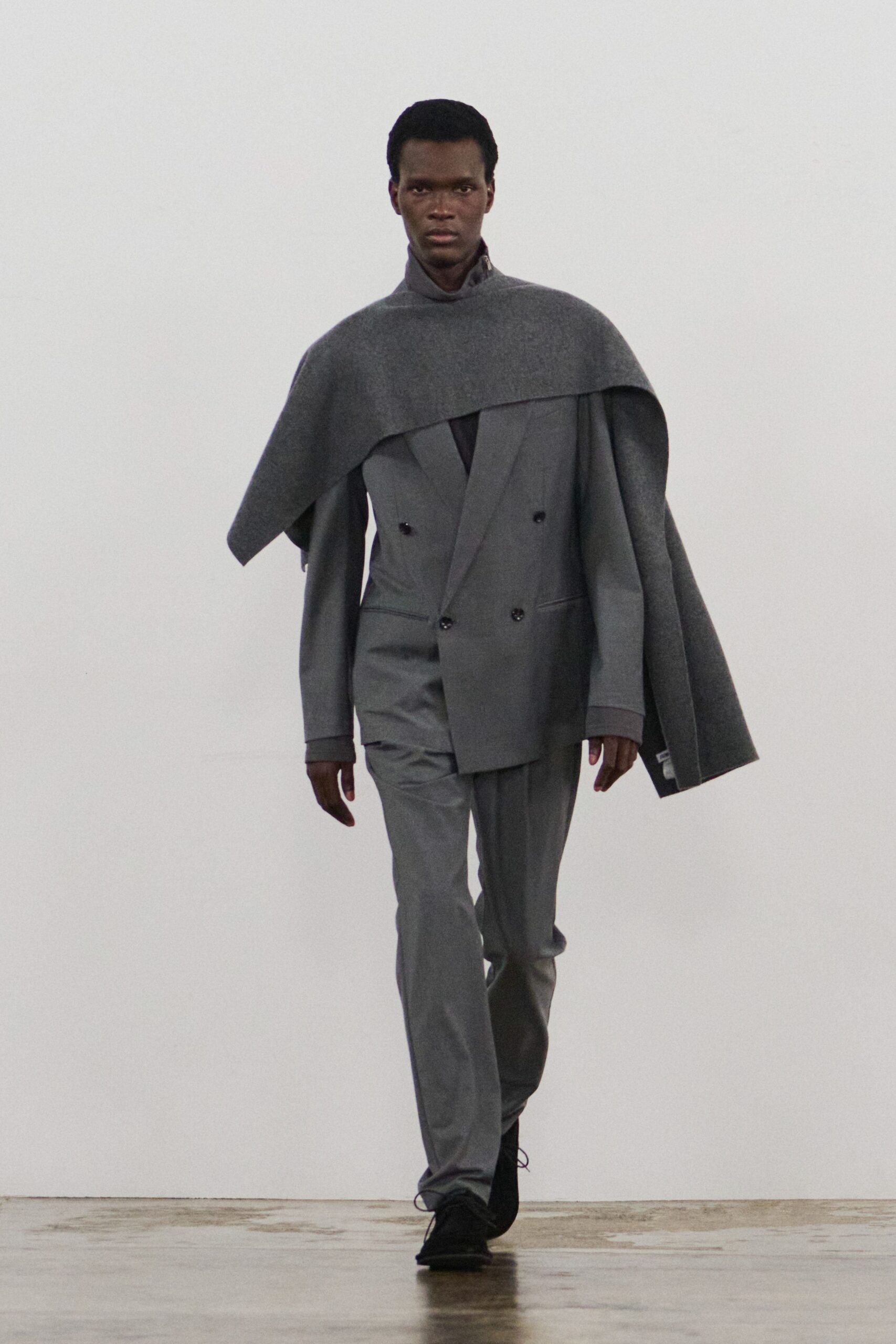 gray tailored suit with cape