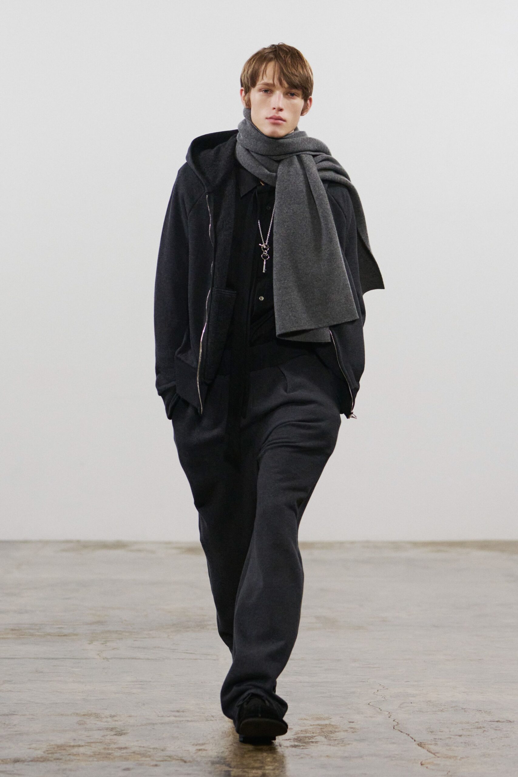 black hoodie and gray pants