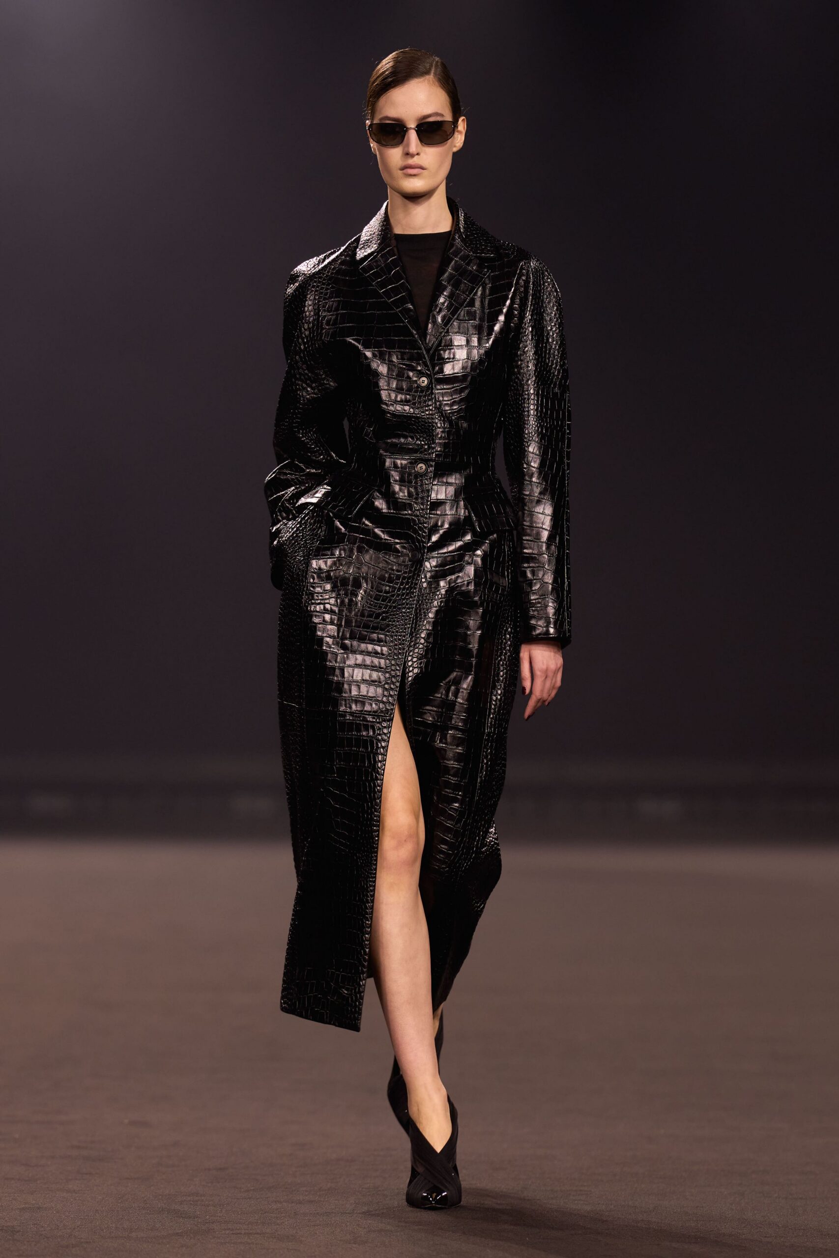 black vinyl long-sleeve collared fitted textured shiny coat