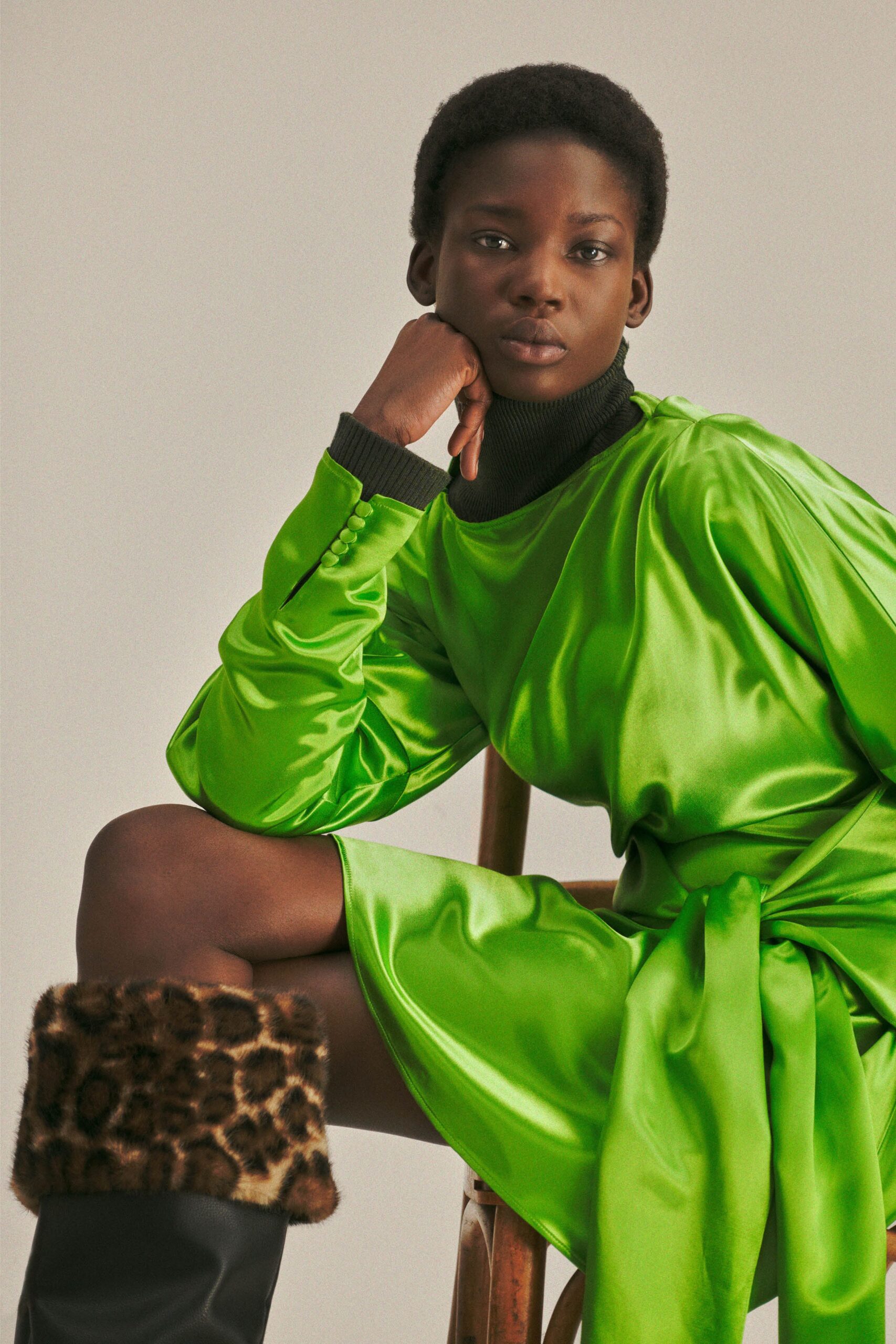 green satin long-sleeve high-neck fitted draped shiny dress
