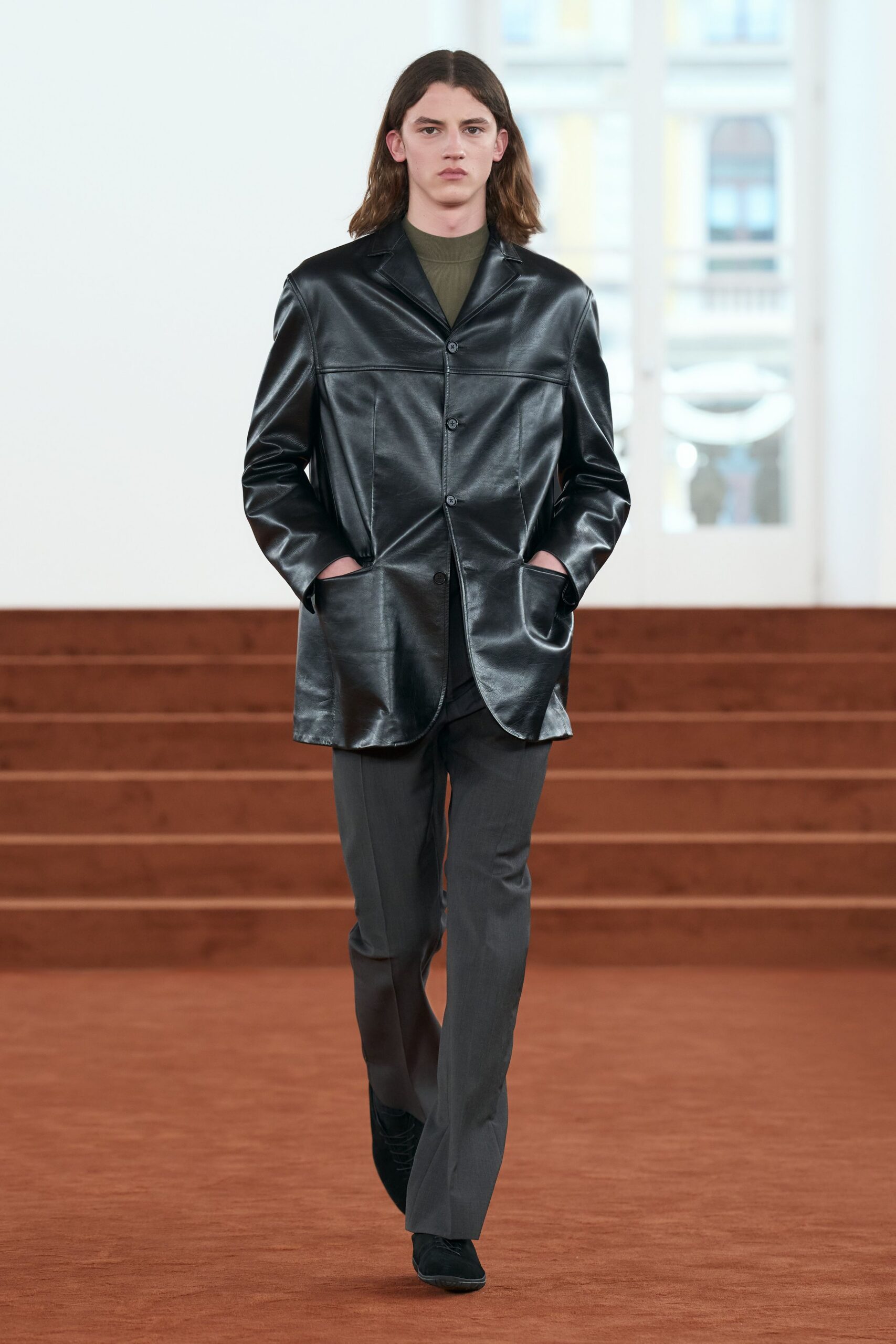 black leather long-sleeve collared structured buttoned jacket